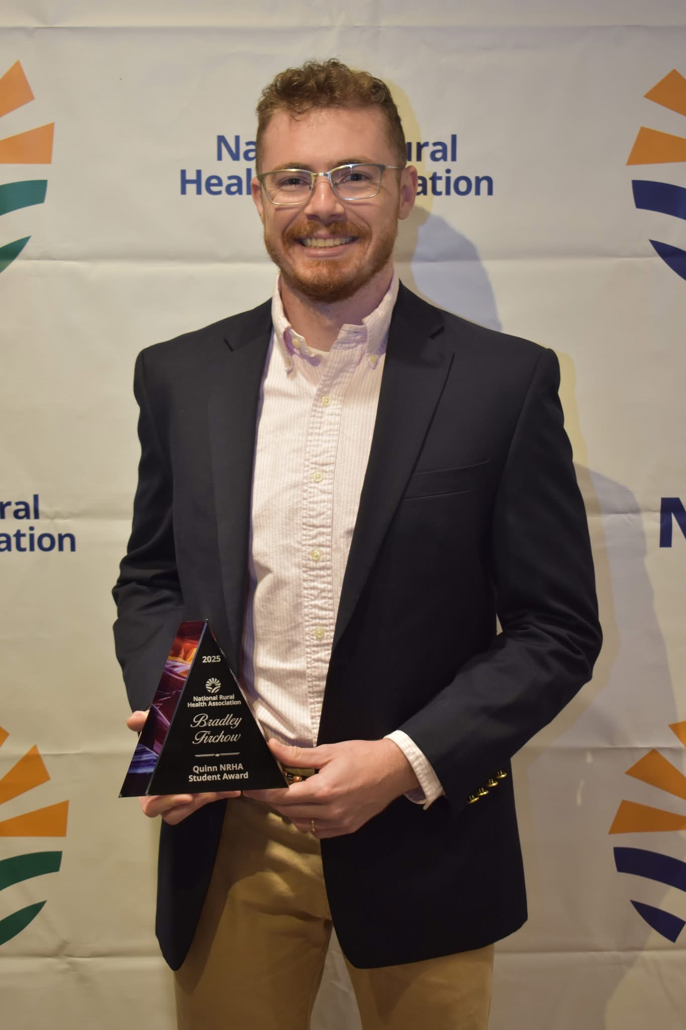 Bradley Firchow poses with NRHA Award
