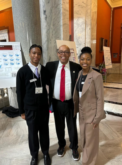 Botshelo Angoma, State Senator Reginald L. Thomas, and Mandy Dickerson