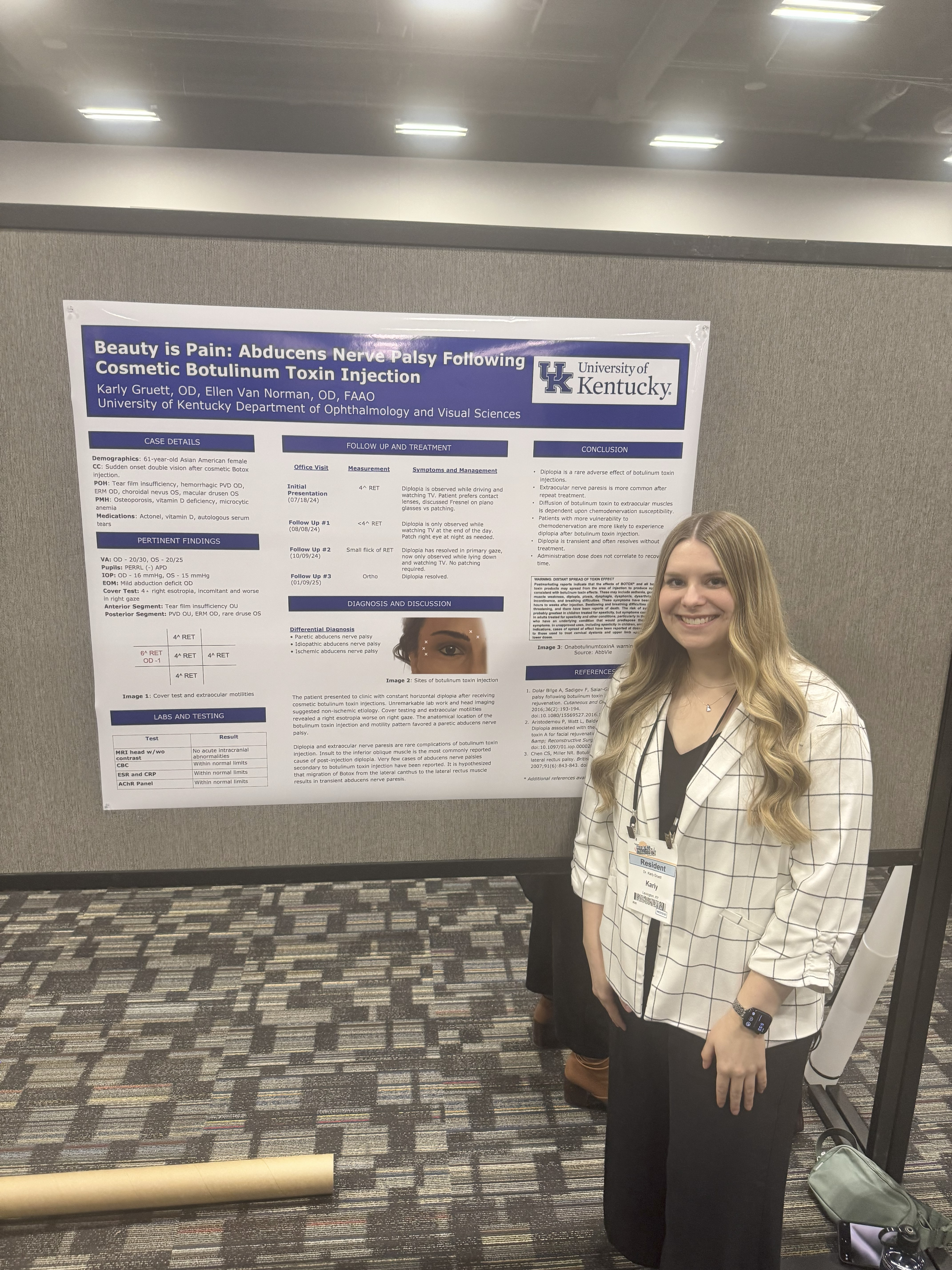 Karly Gruett 2025 Optometry resident standing infront of her poster. 