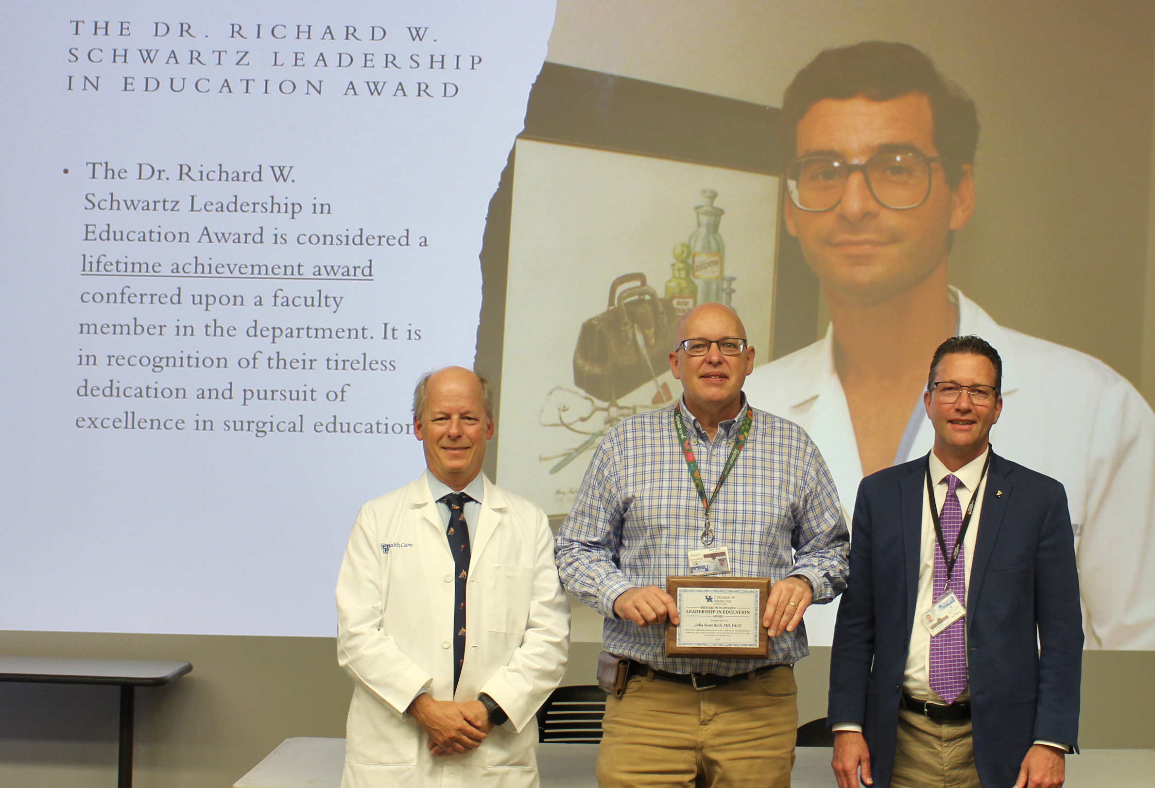 Dr. William B. Inabnet, Department of Surgery Chair (Left) and Dr. Andrew Bernard, Division Chief and previous Schwartz Award winner, present Dr. John Roth with the Schwartz Award Lifetime Achievement Award for Teaching