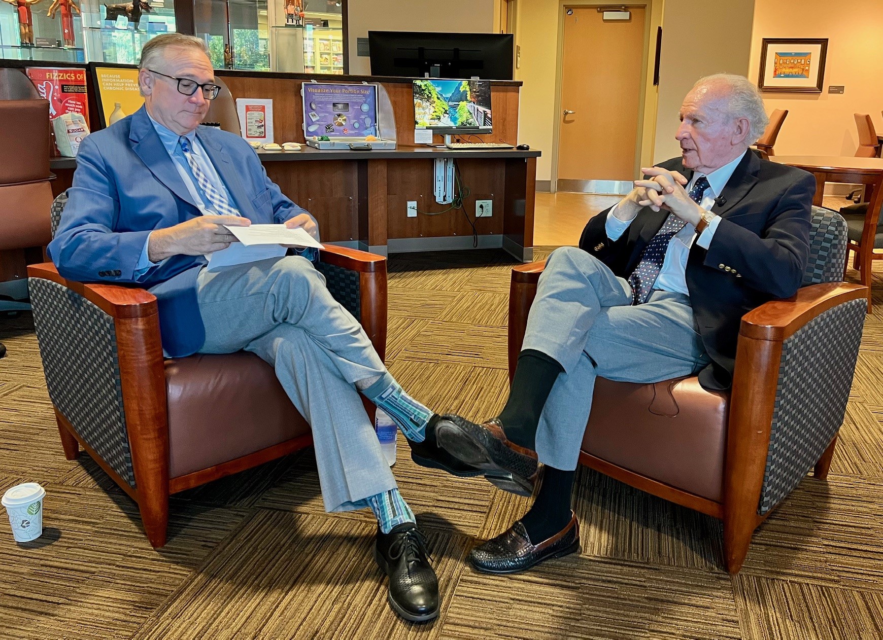 Stephen Strup, MD, and J. William Roberts meeting to discuss new endowment in library setting 