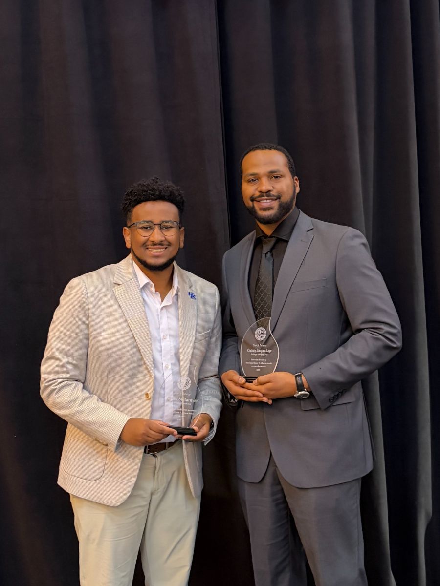 Kidus Shiferawe (left) and Cortney Laye (right) pose with their awards