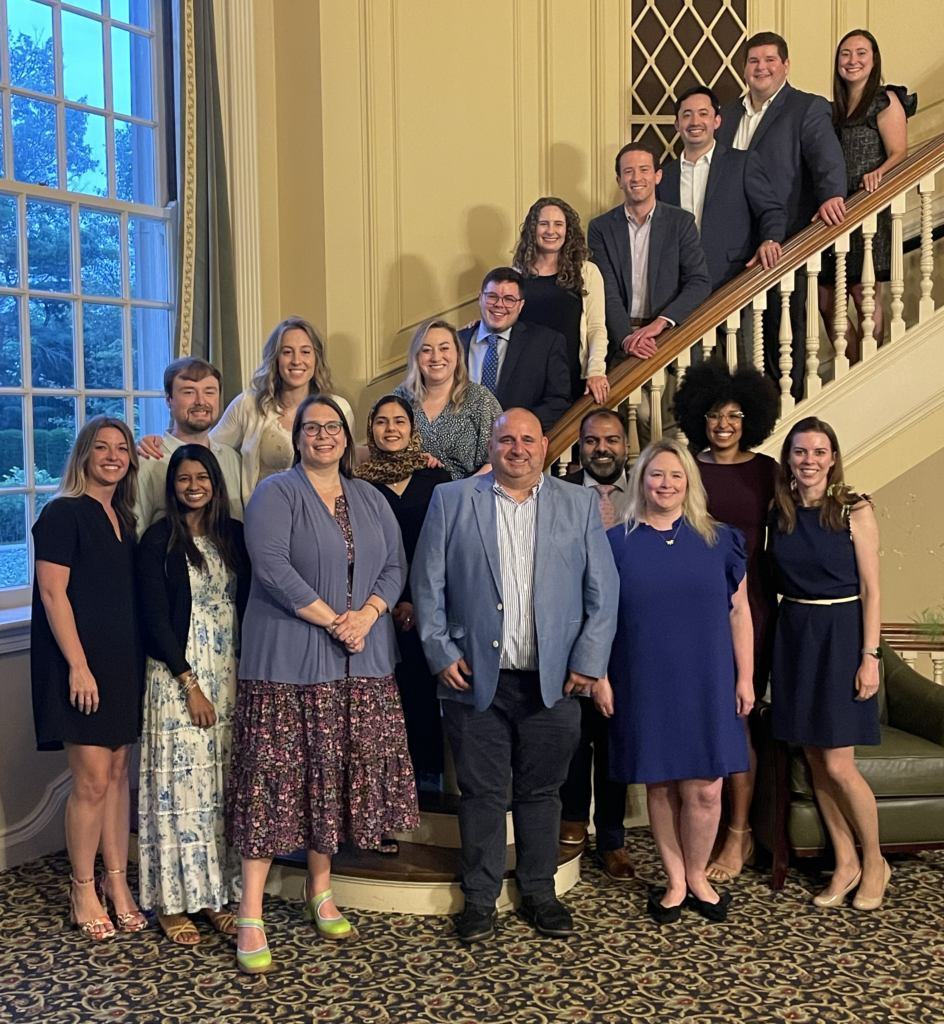 group shot of graduates and faculty at Spindletop Hall