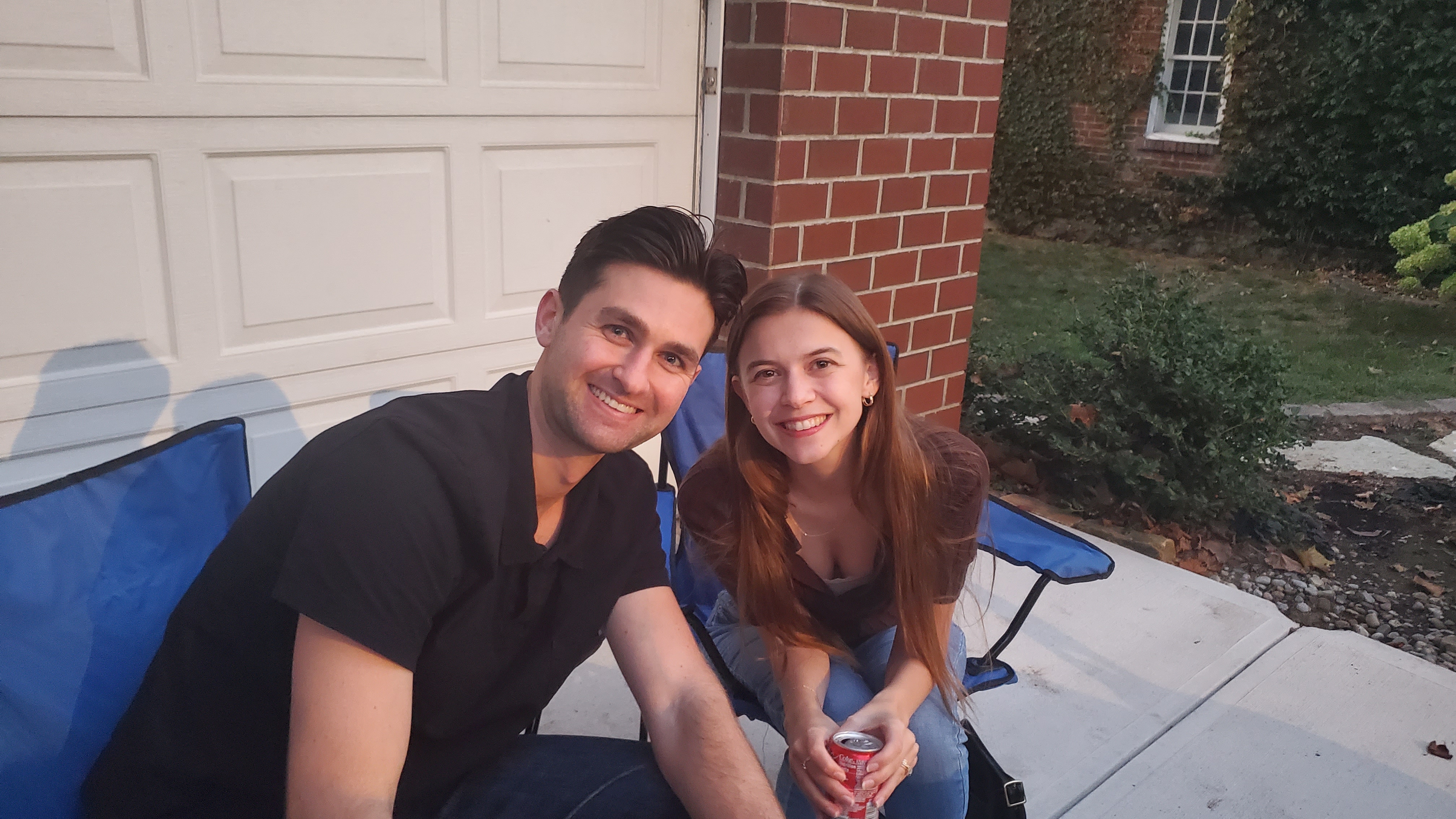 Dr. Ashley Graf and spouse outside