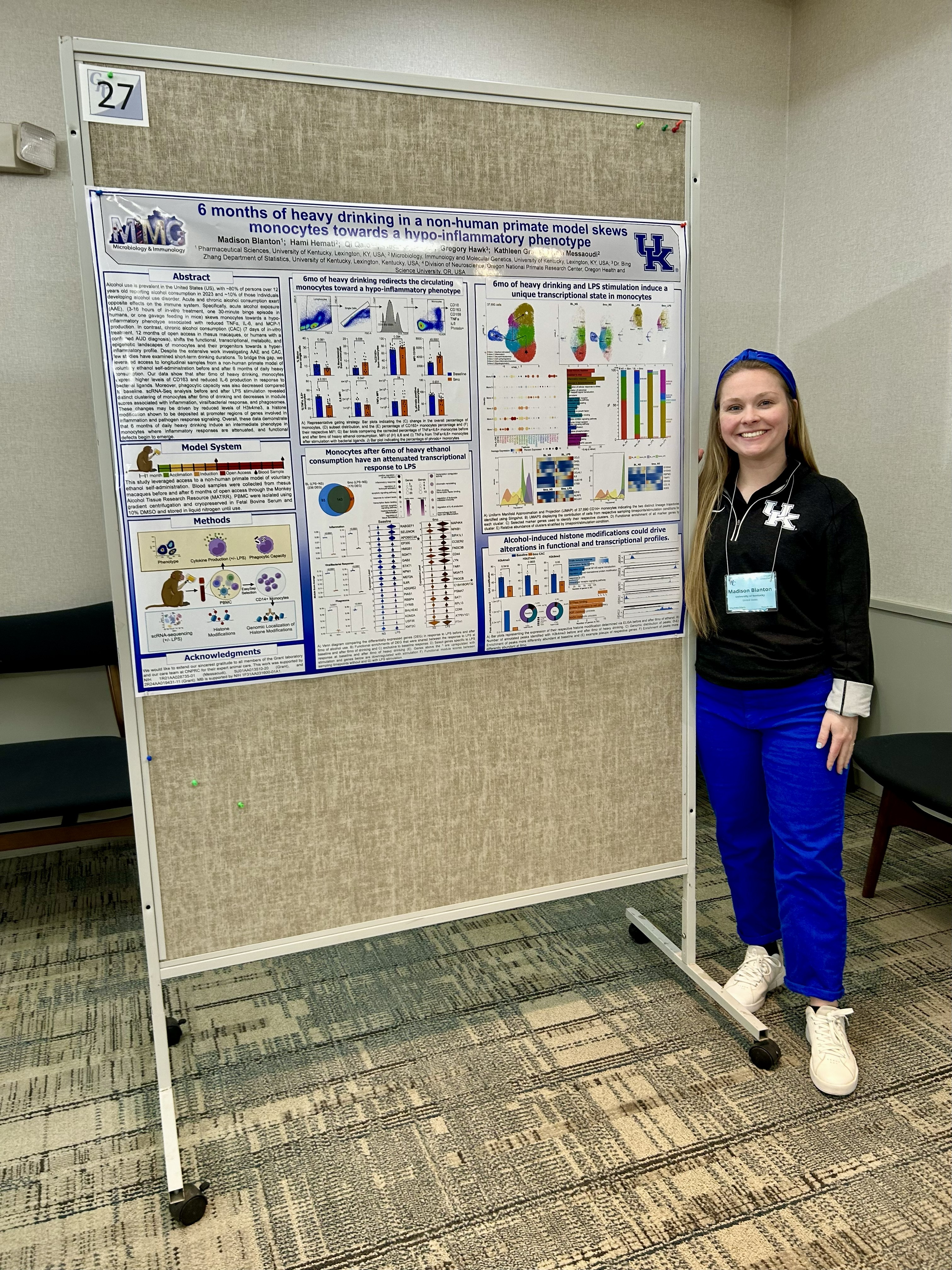 Madison Blanton standing by her scientific poster.