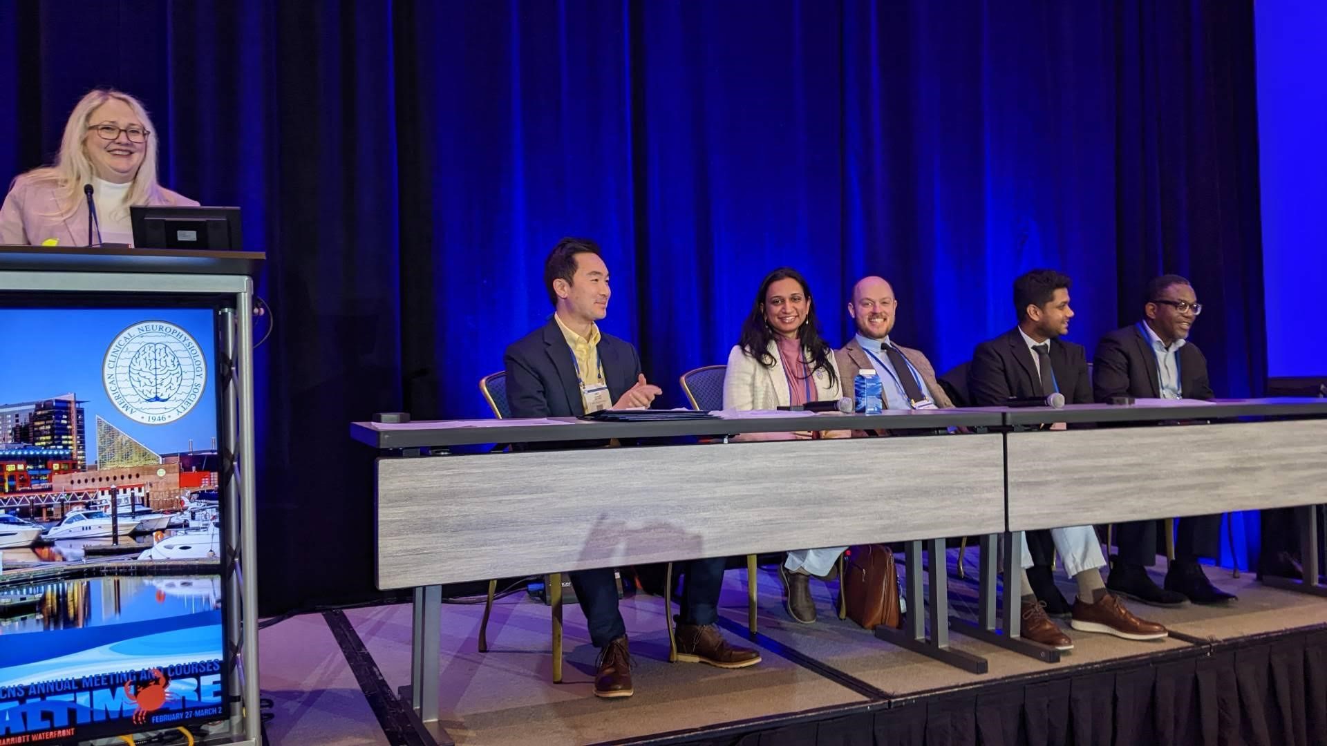Picture of a panel at the 2025 ACNS Conference featuring Dr. Zabeen Mahuwala and Dr. Jordan Clay in the center.