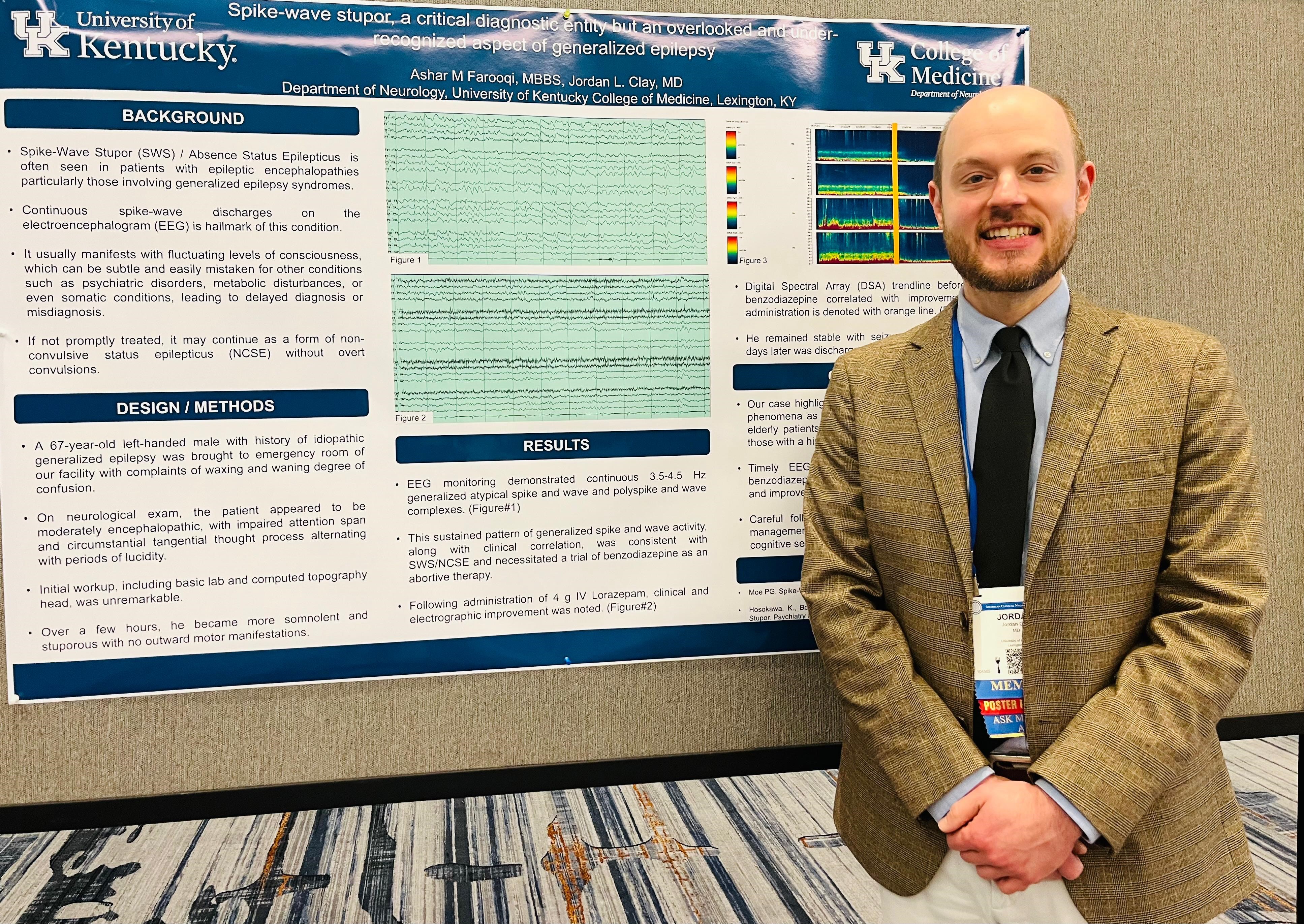 Picture of Dr. Jordan with his poster presentation at the 2025 ACNS Conference