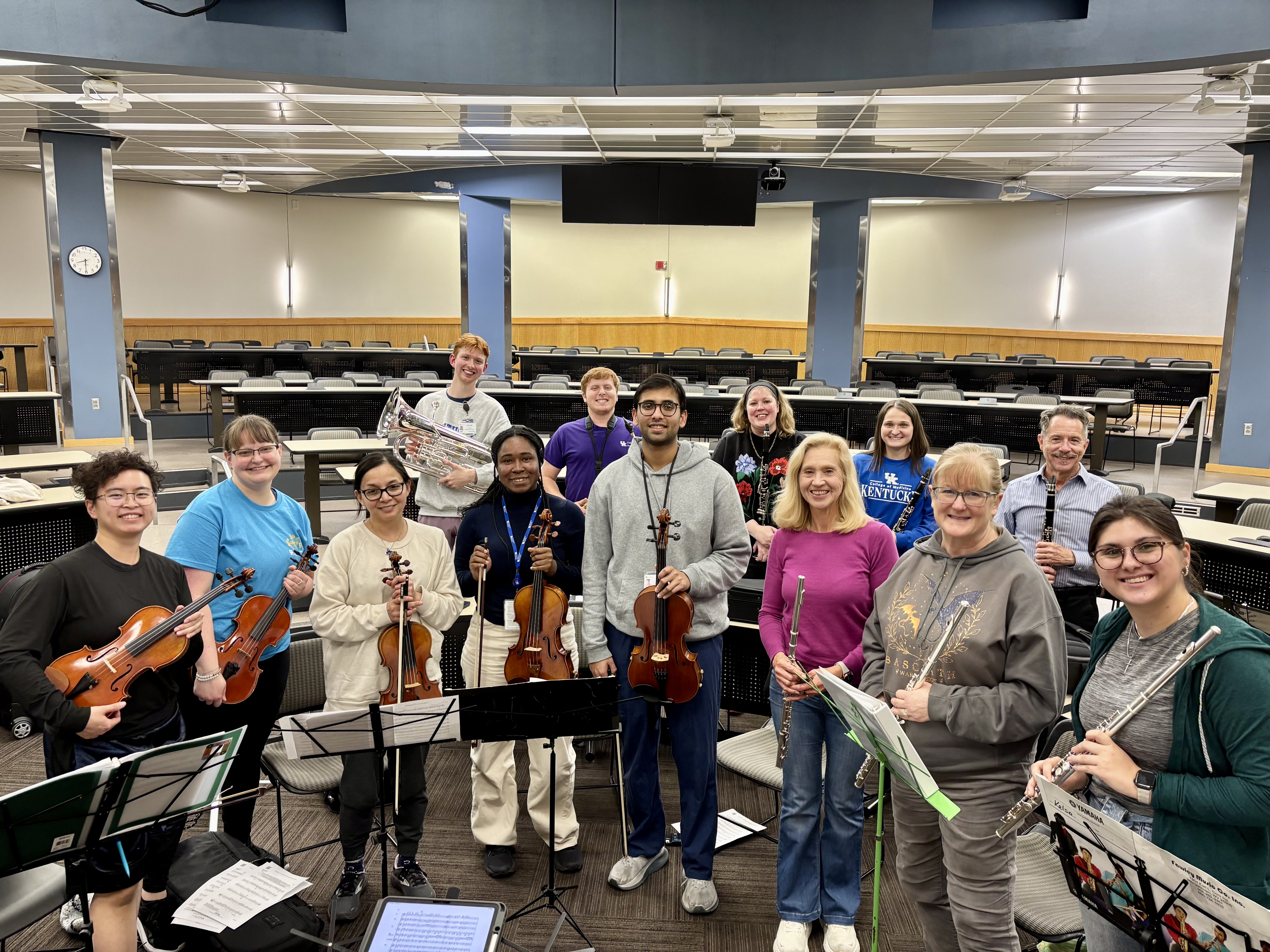 Members of the medical orchestra pose for a photo after practice. 