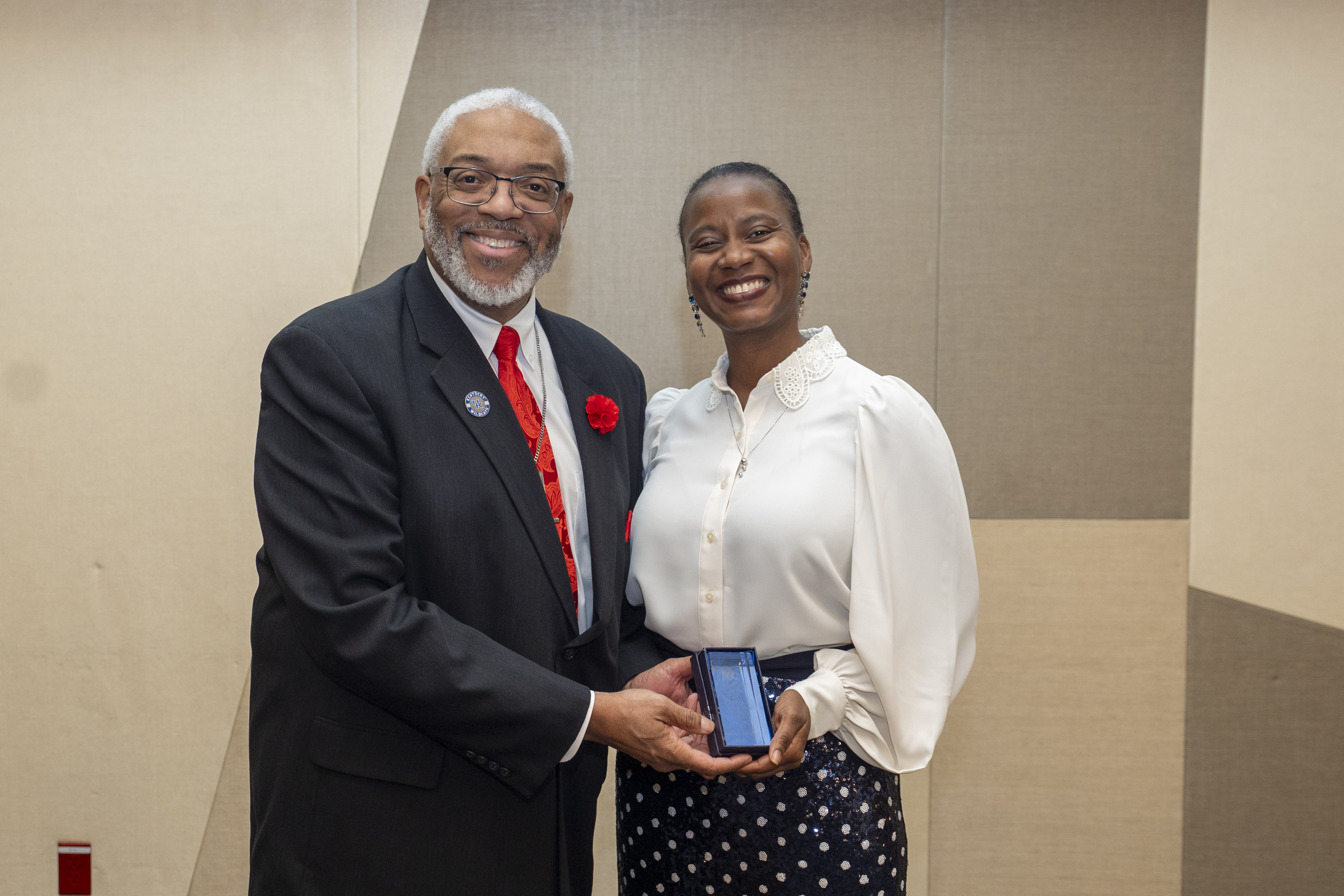 Doctor Darwin Conwell presents Doctor Lanla Conteh with an endowment award