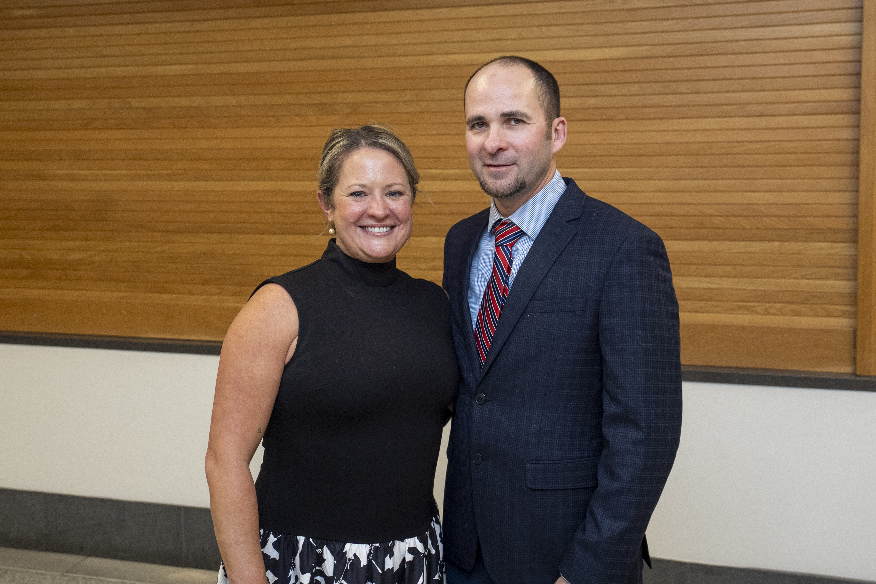 A woman and a man pose for a photo together