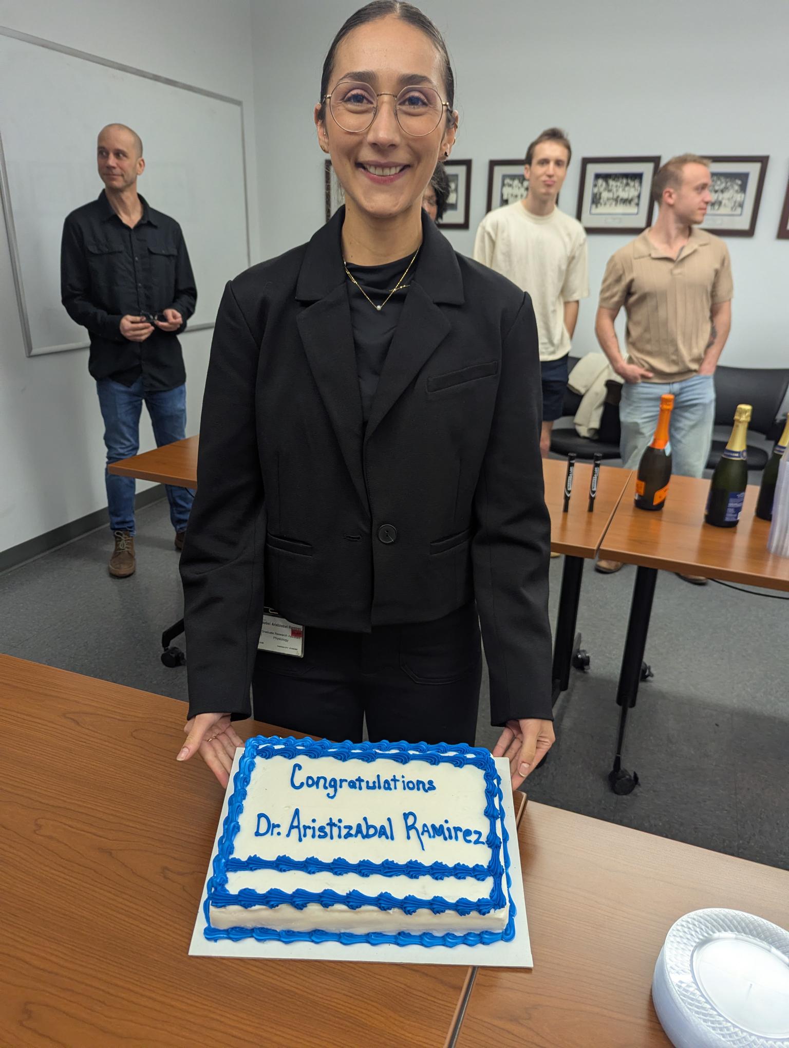 Dr. Aristizabal Ramirez displays her congratulatory cake. 