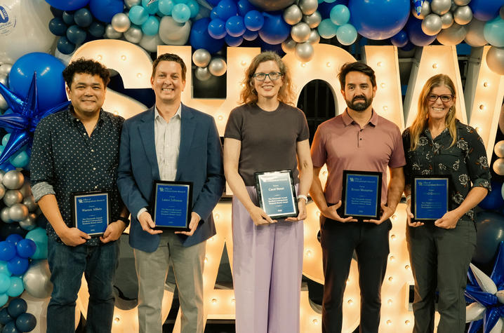 From left: Warren Alilain, Lance Johnson, Carol Street, Bruno Menarim and Sybil Gotsch standing in front of decorative lights that read, "SHOWCASE"
