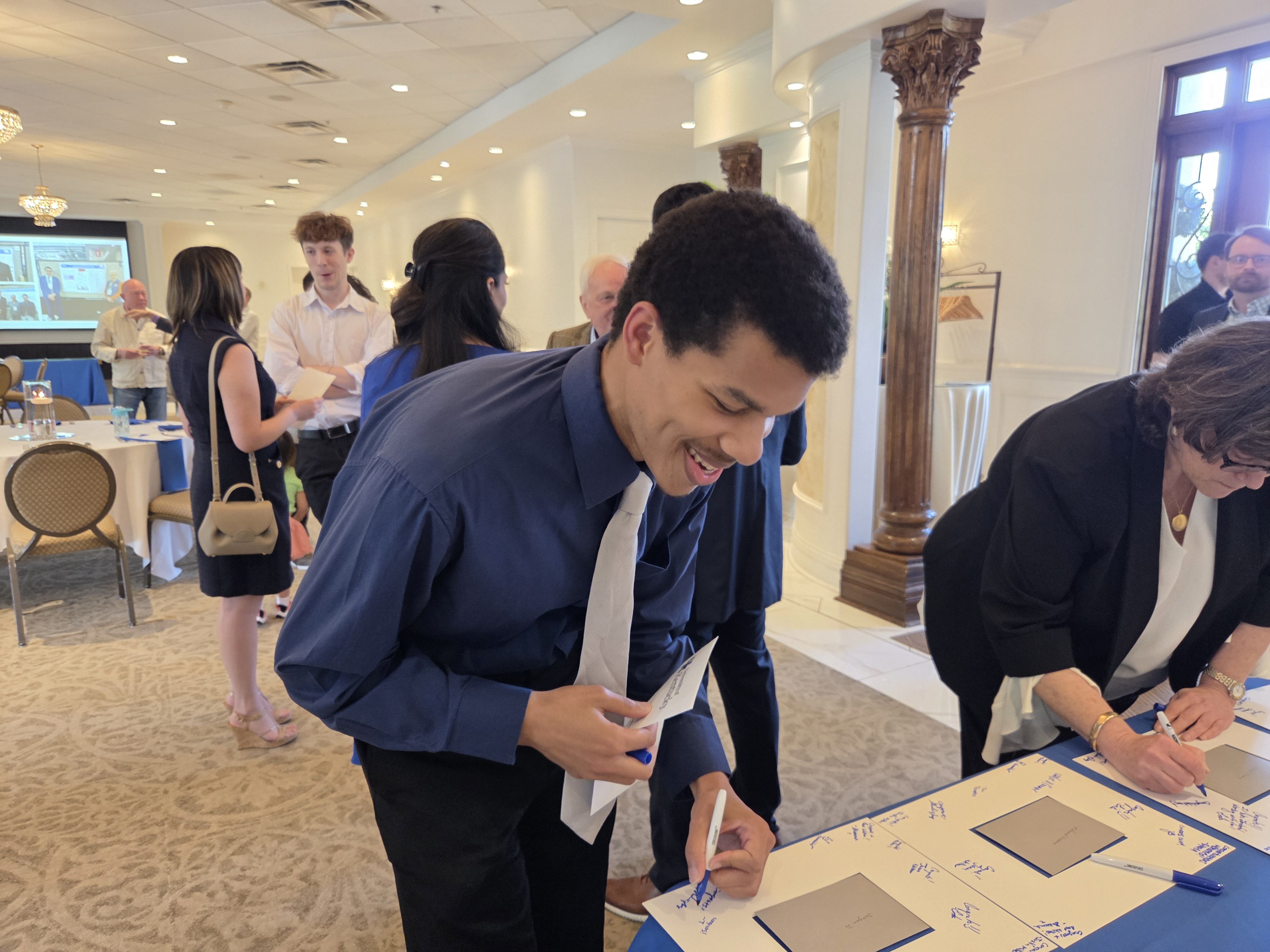 Image of Resident signing photo