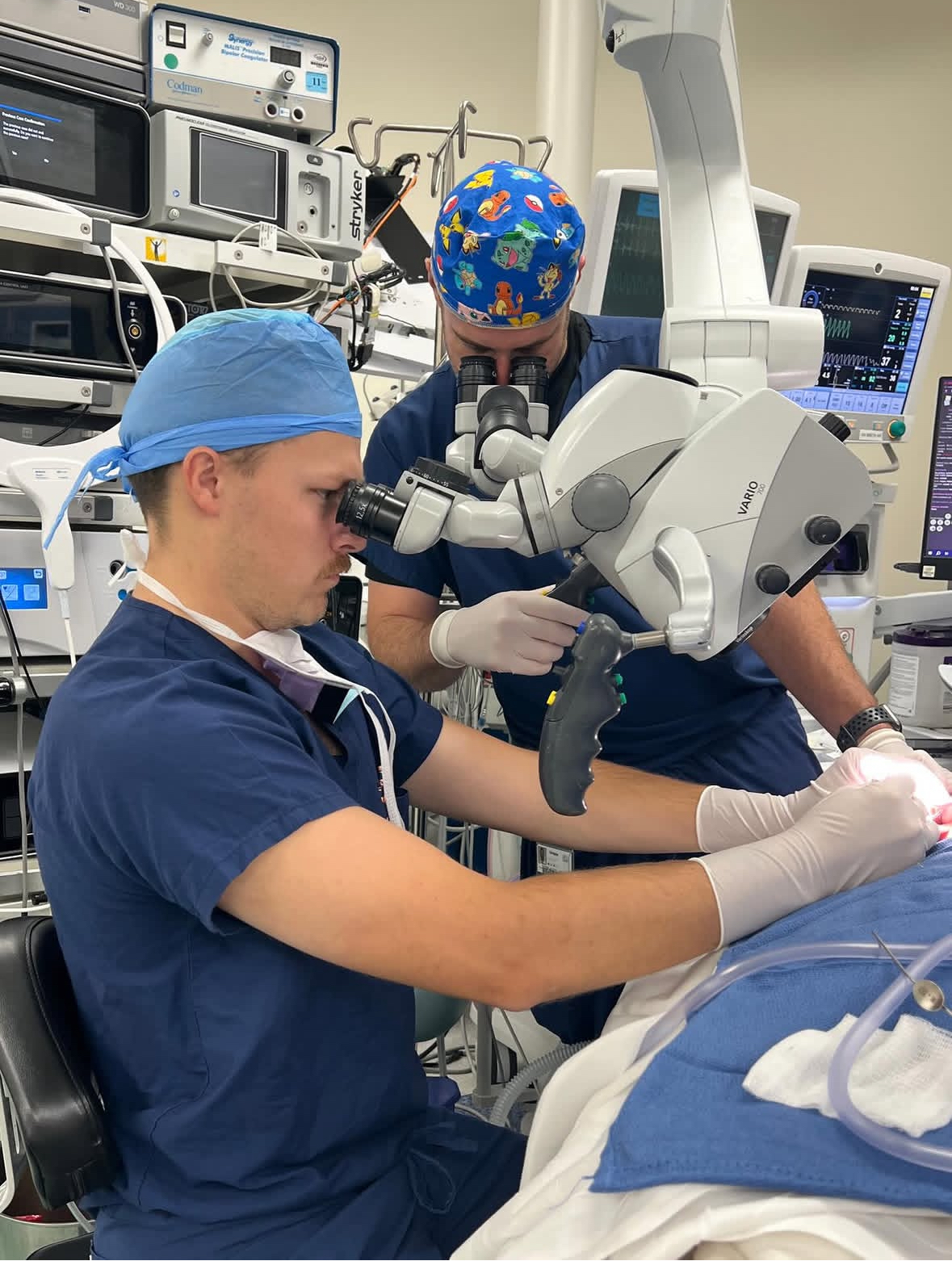 A close up of an otolaryngology resident "operating" during a simulation. 