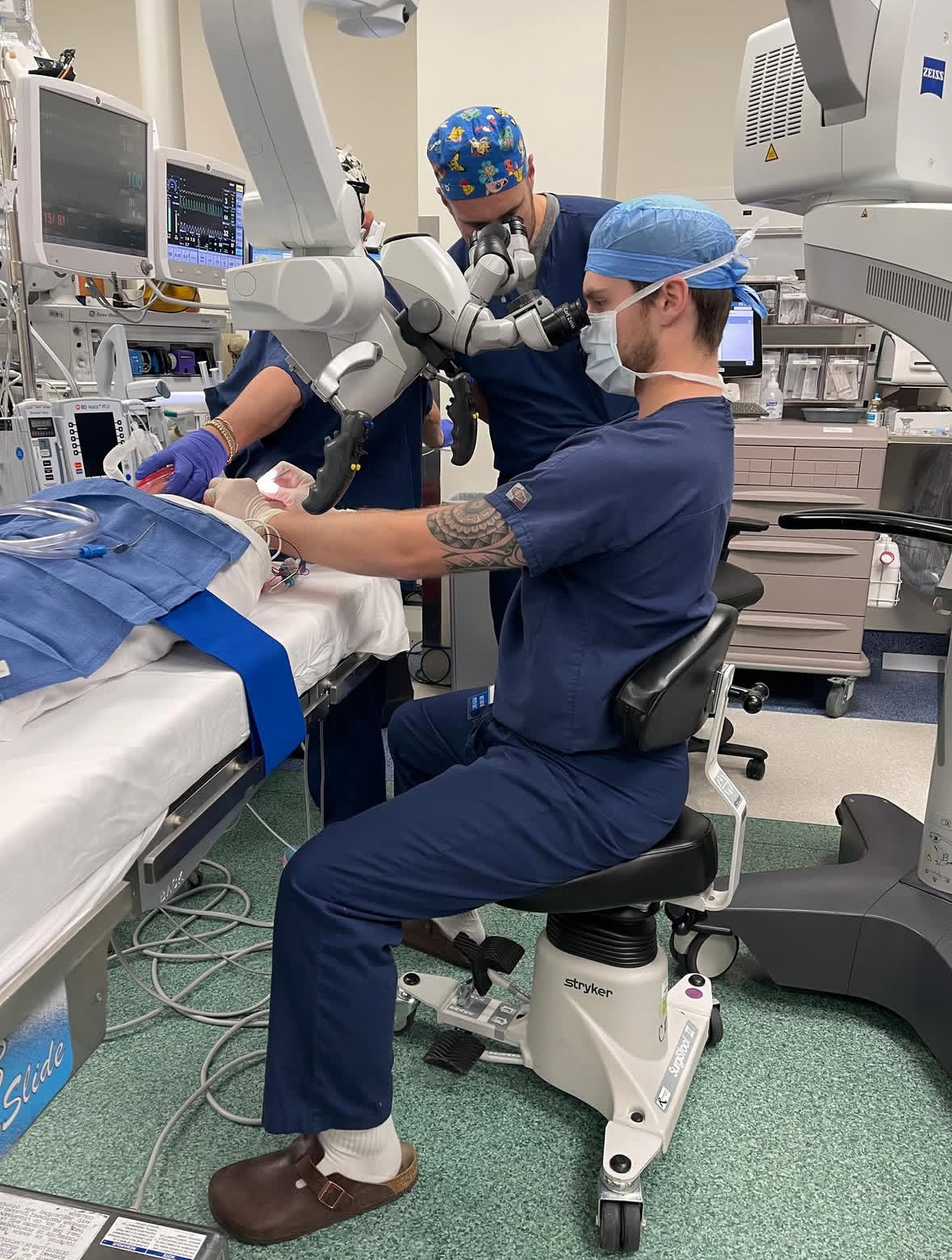 A close up of an otolaryngology resident "operating" during a simulation. 