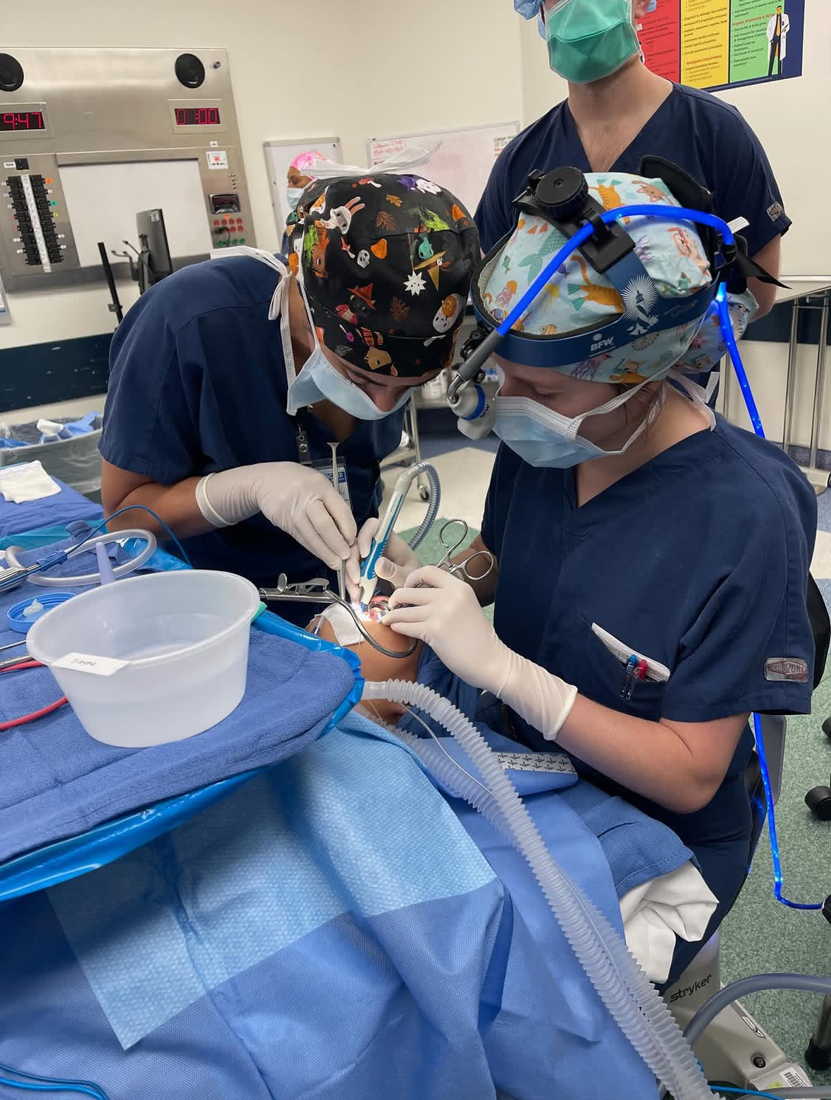 A close up of an otolaryngology resident "operating" during a simulation. 