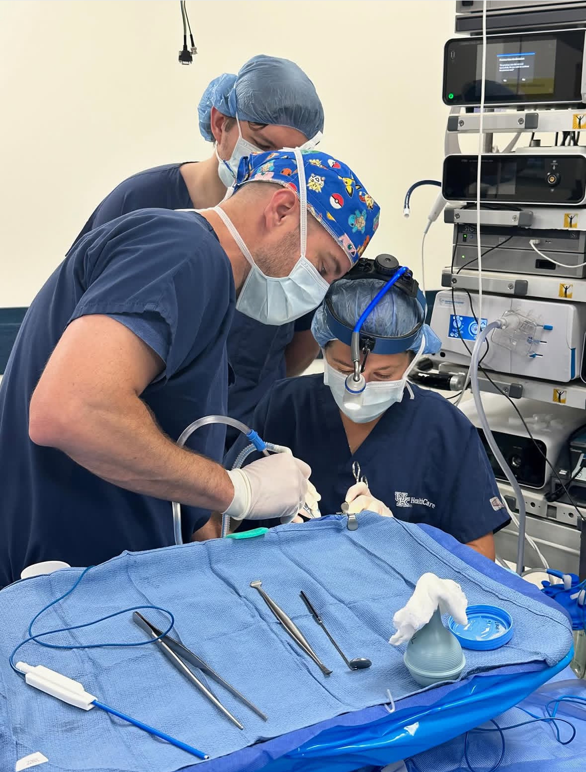 A close up of an otolaryngology resident "operating" during a simulation. 