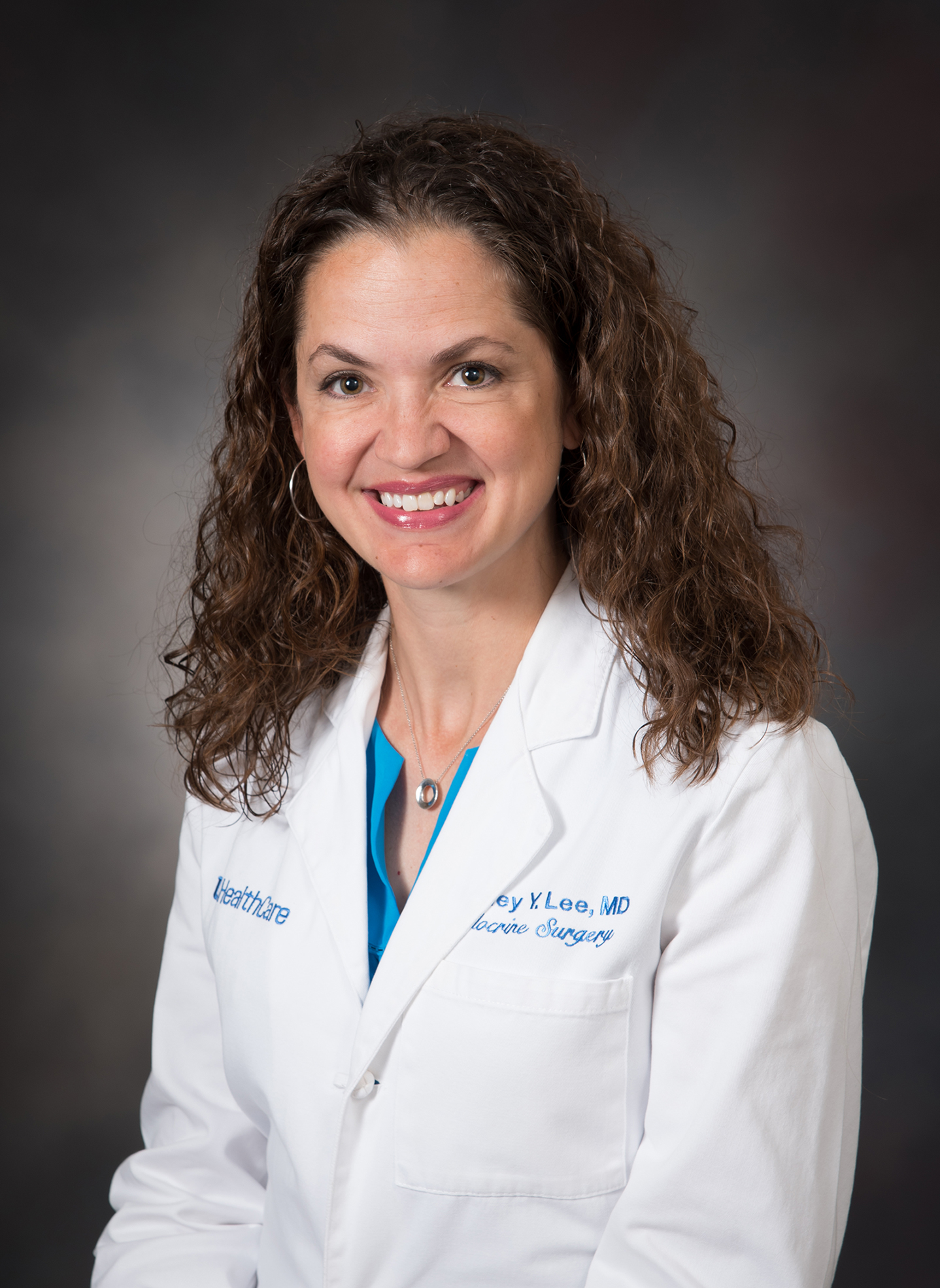 Dr. Cortney Lee in white coat