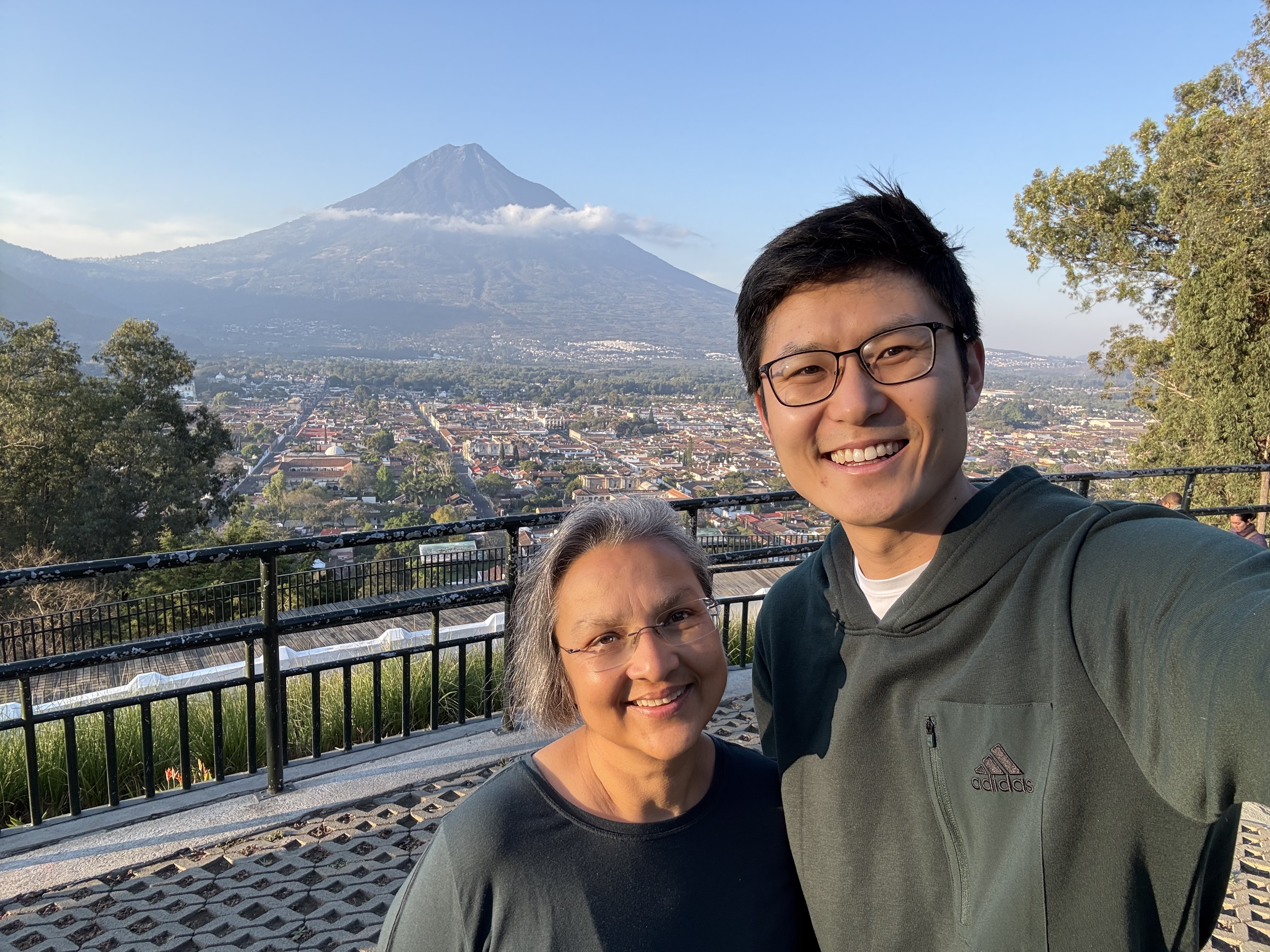 Drs. Seema Capoor (left) and Kevin Wang (right) in front of Volcán de Agua in Antigua, Guatemala.