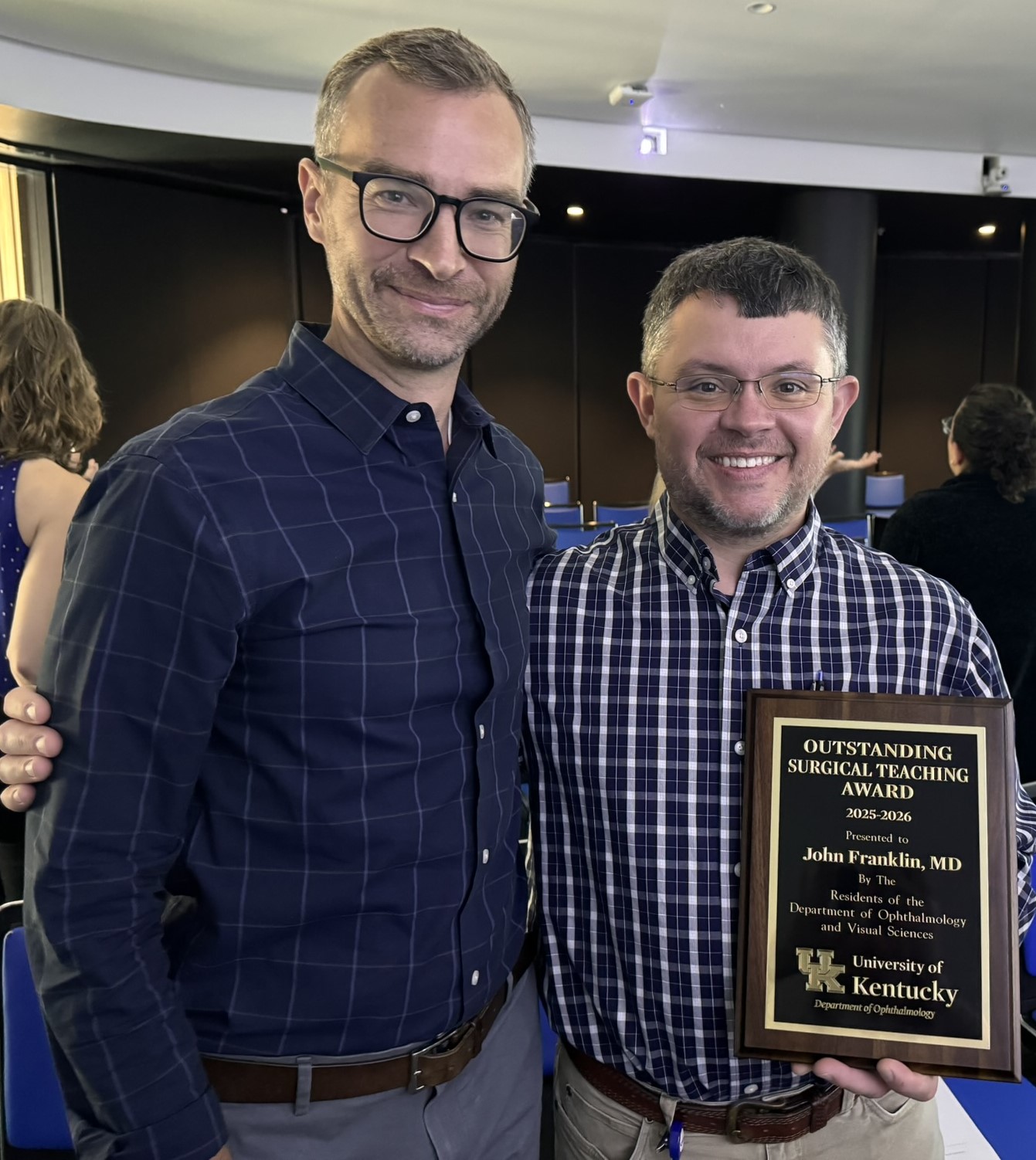 Dr. Daniel Moore and Dr. John Franklin standing together with Dr. Franklins Outstanding Teaching Award