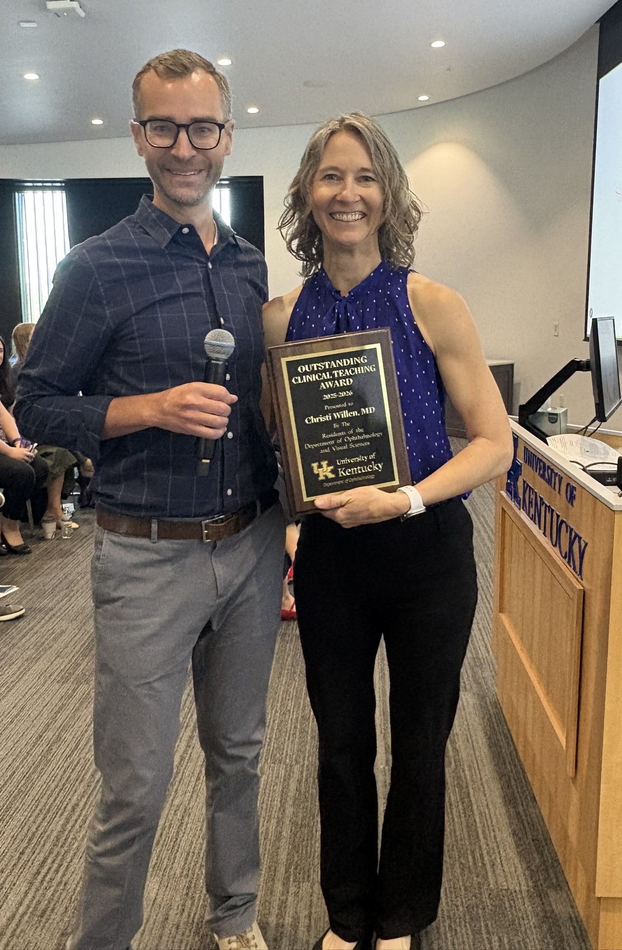 Dr. Daniel Moore and Dr. Christi Willen standing together with Dr. Willens Outstanding Teaching Award