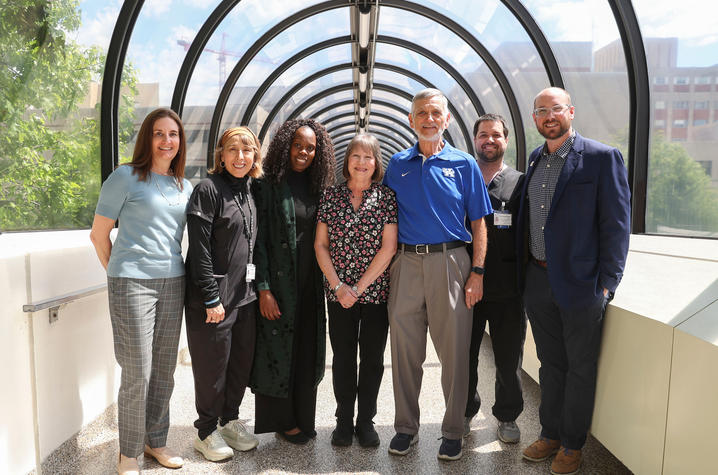 Photo of Klim with his wife and ICU Recovery Clinic care team.