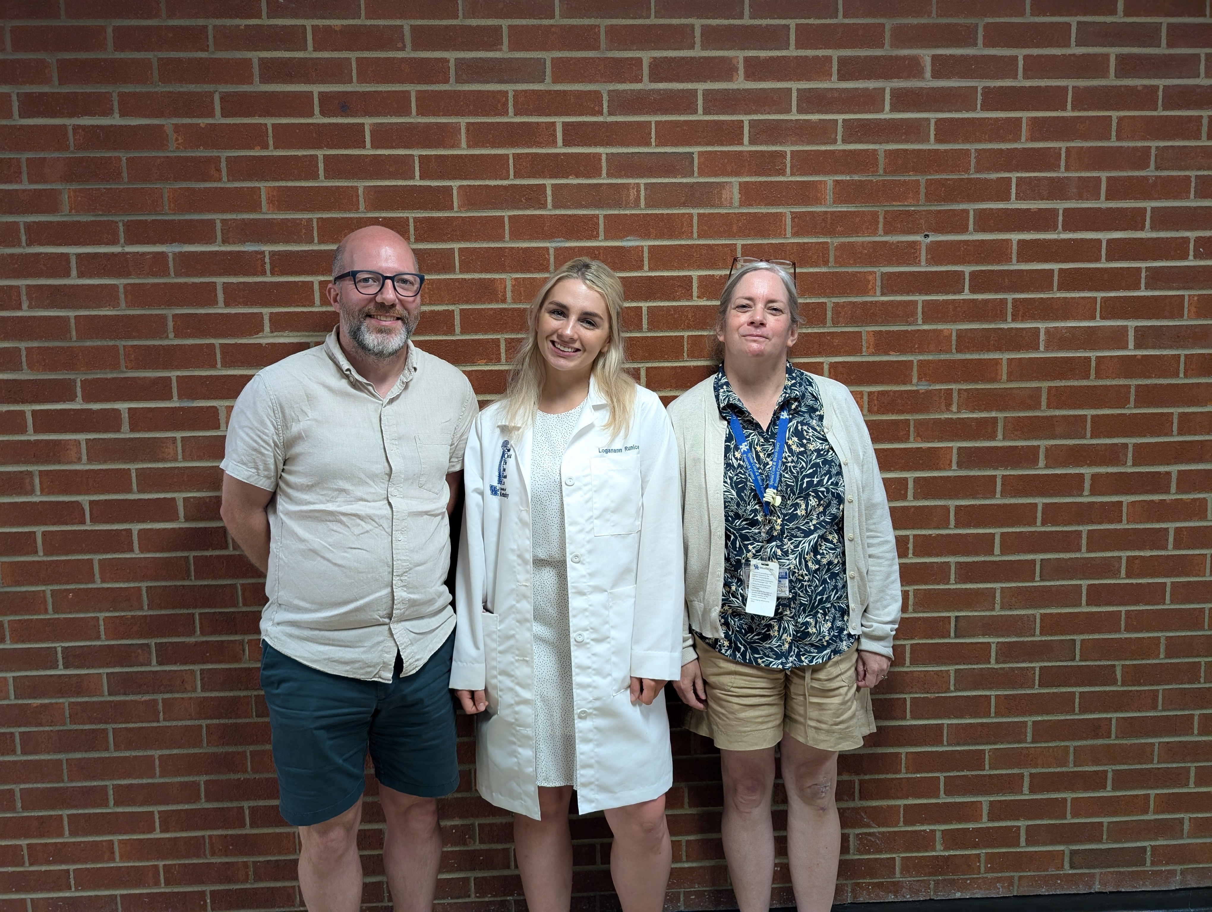 Loganann Runice with mentors, Drs. Ann Stowe and Vince Venditto 