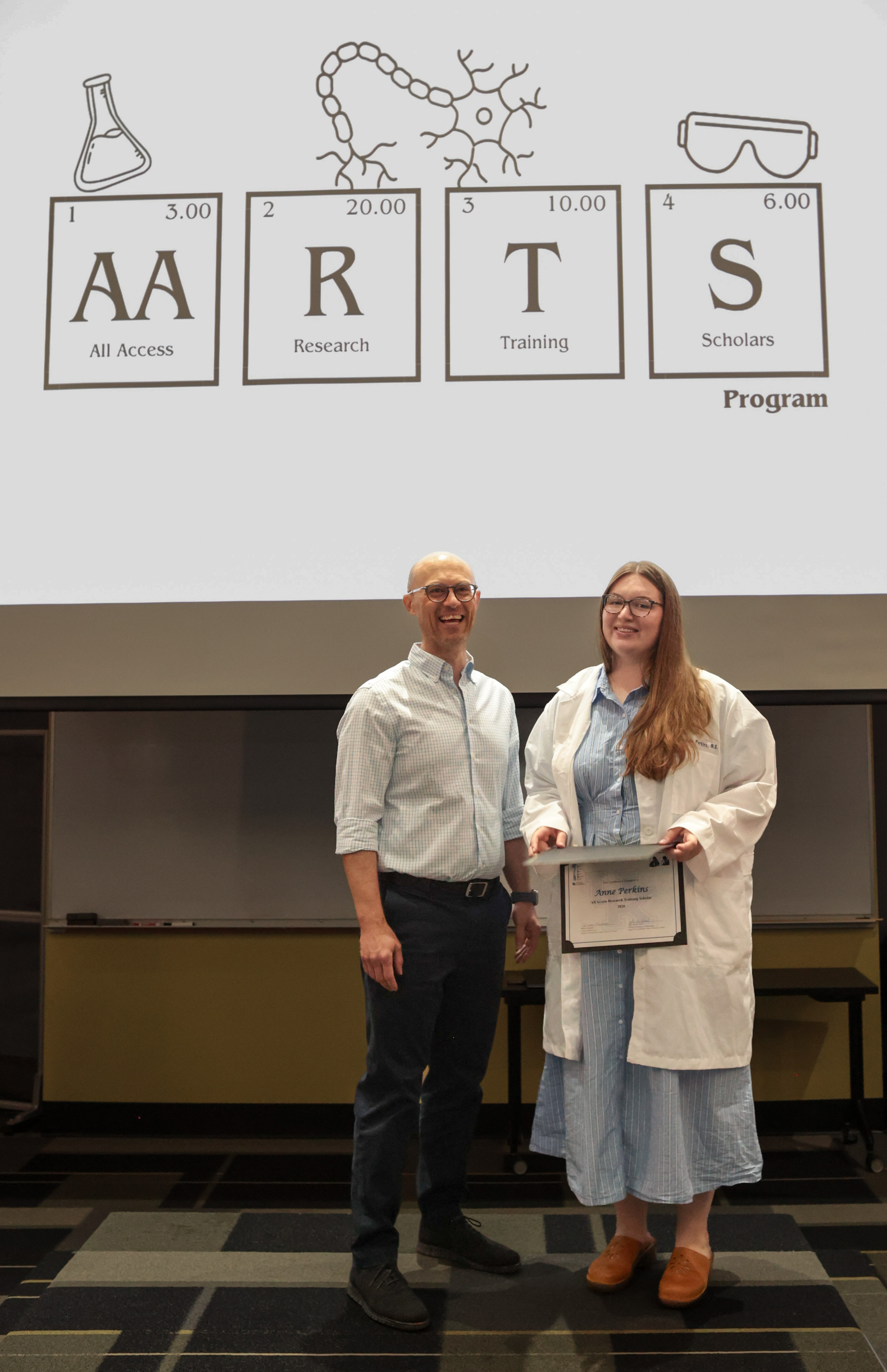 Anne Perkins and mentor Dr. Adam Bachstetter during the AARTS 2026 Symposium.