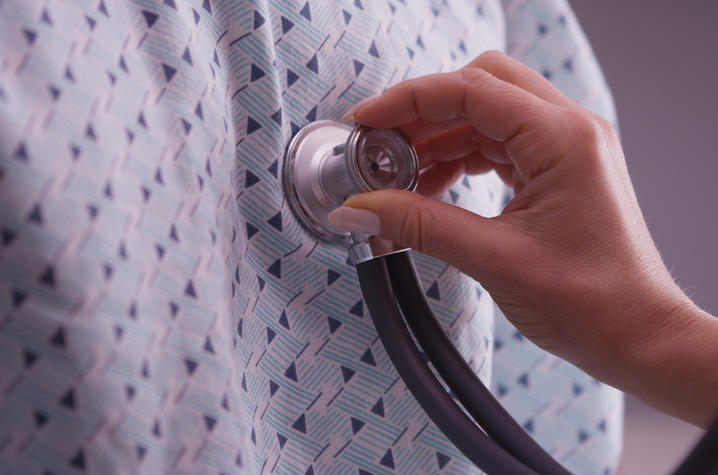Stethoscope held over a person's chest.