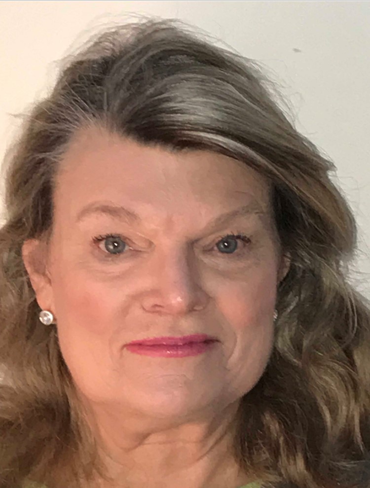 close-up photo of woman with curled blonde hair and red lipstick