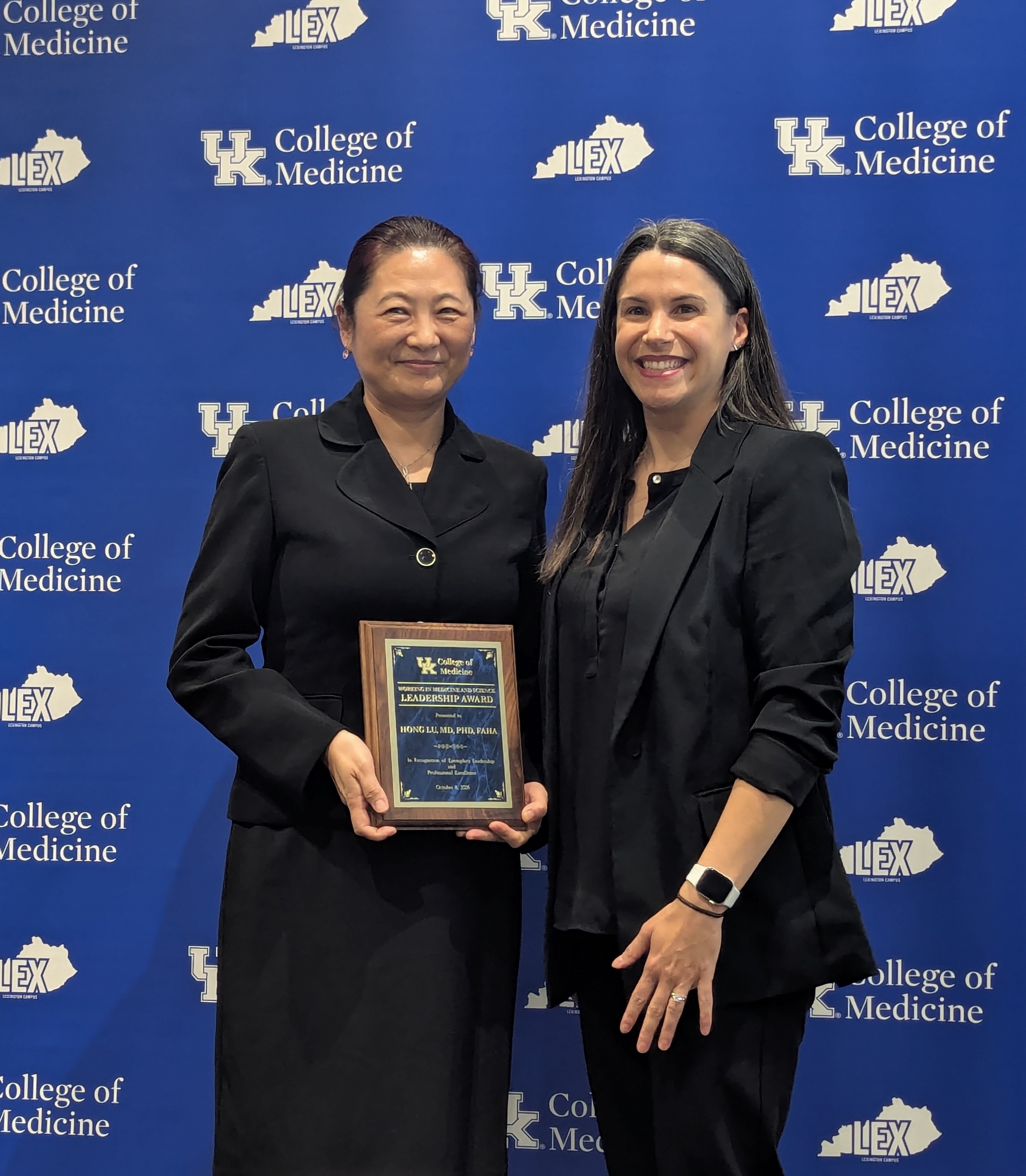 WIMS award winner Hong Lu, MD, PhD accepts her award.