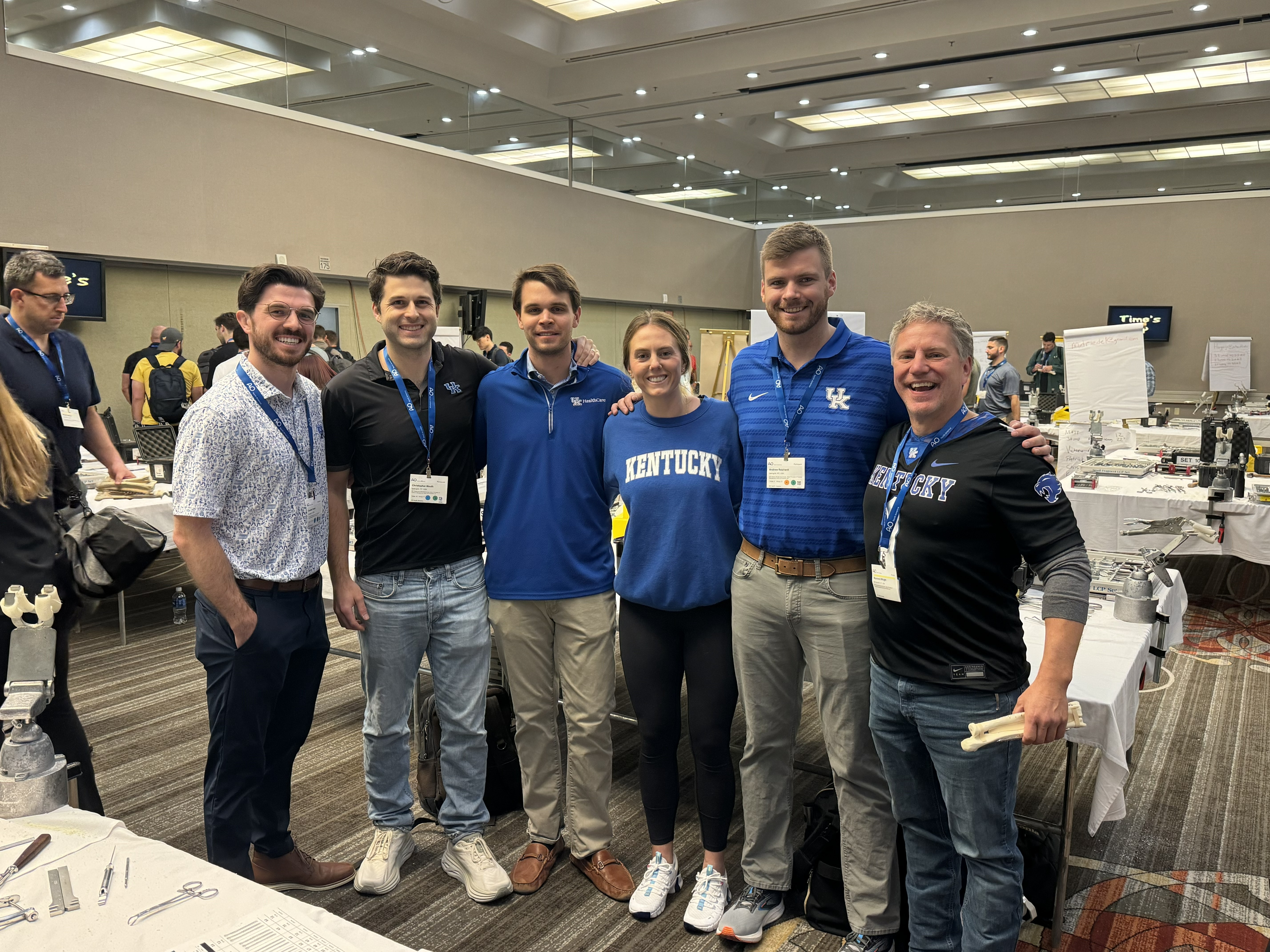 Group of residents representing UK with a faculty member at a skills lab conference