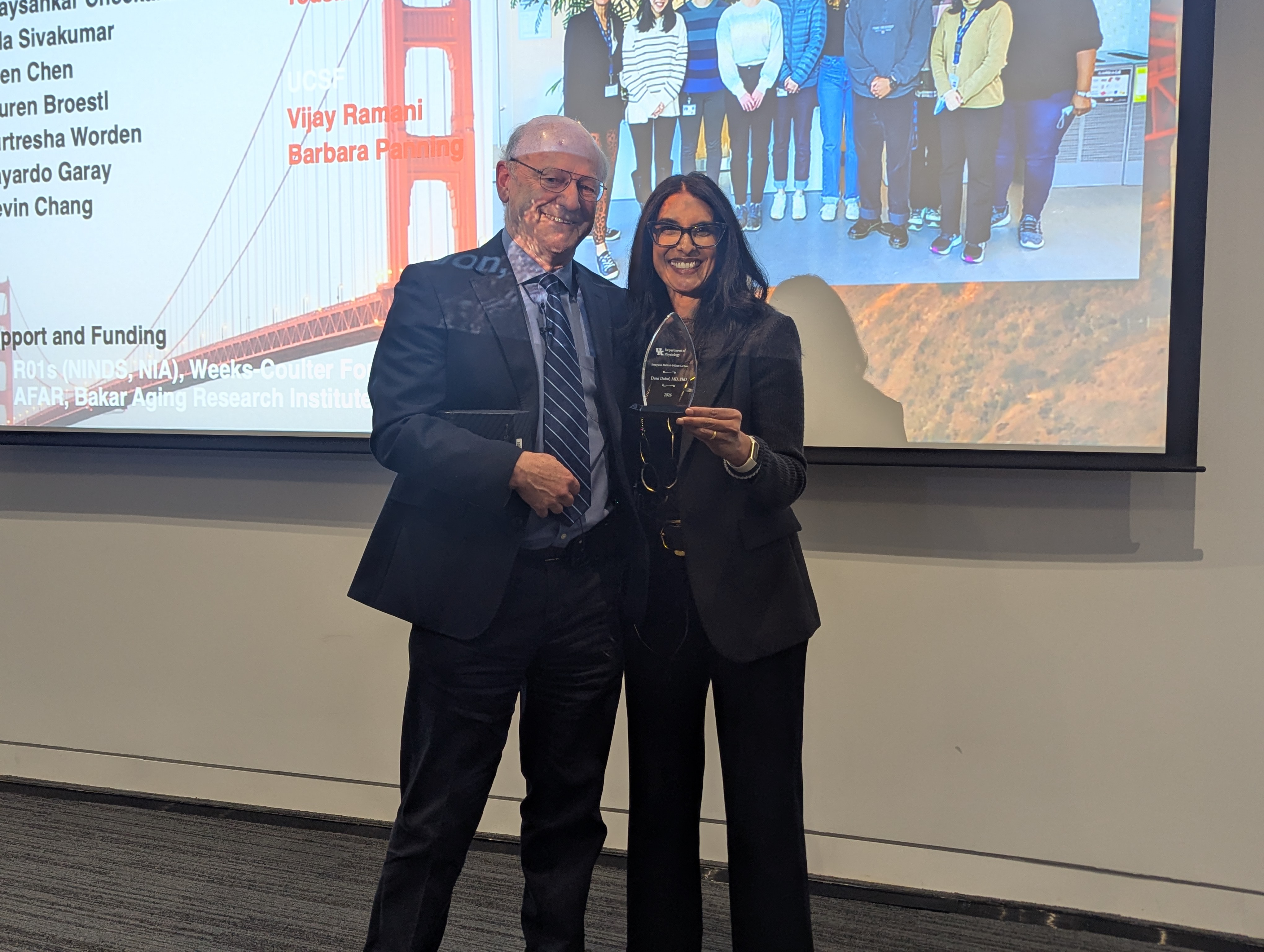 Dr. Alan Daugherty honors Dr. Dena Dubal with an award marking the inaugural lecture of this series. 