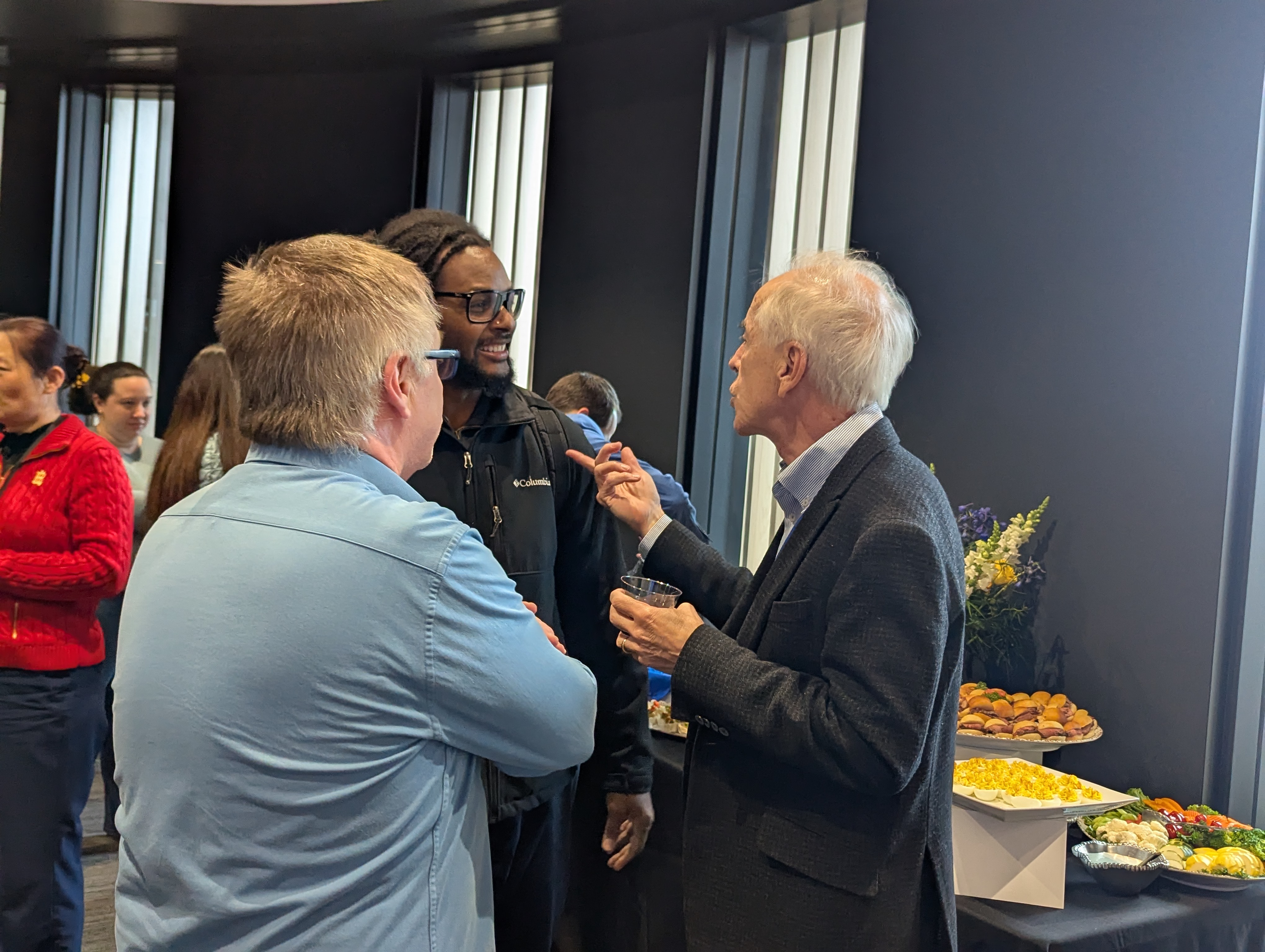 Well-wishers chatting with Dr. Estus