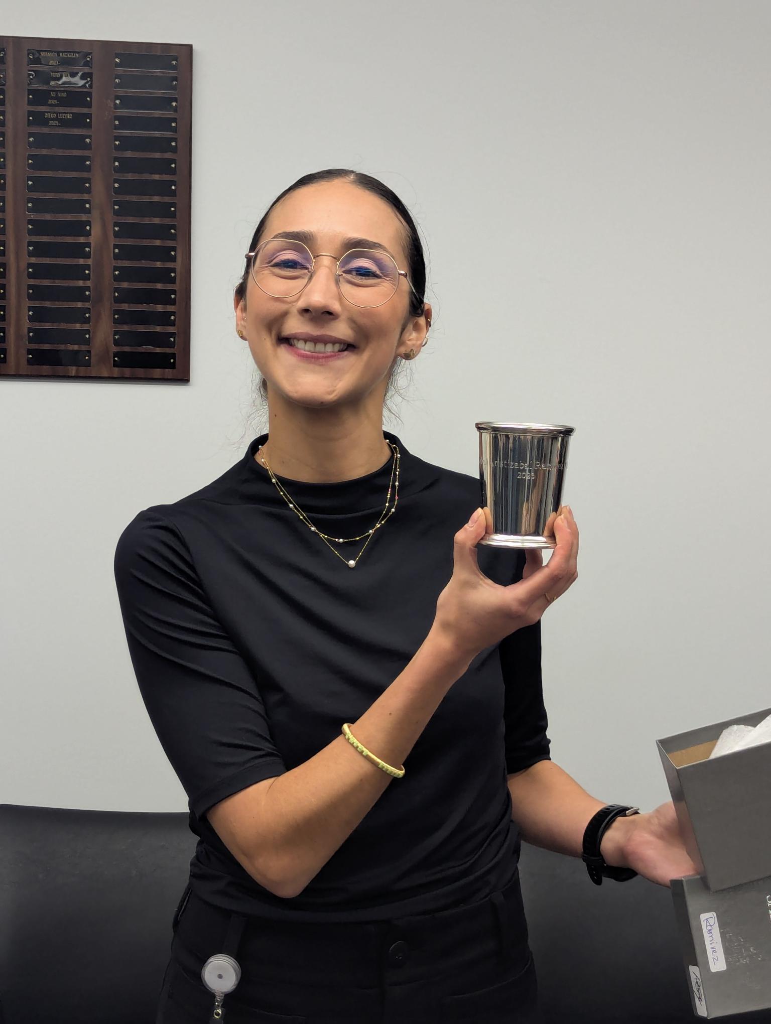 Dr. Aristizabal Ramirez displays her commemorative personalized julep cup, part of a Department of Physiology tradition.