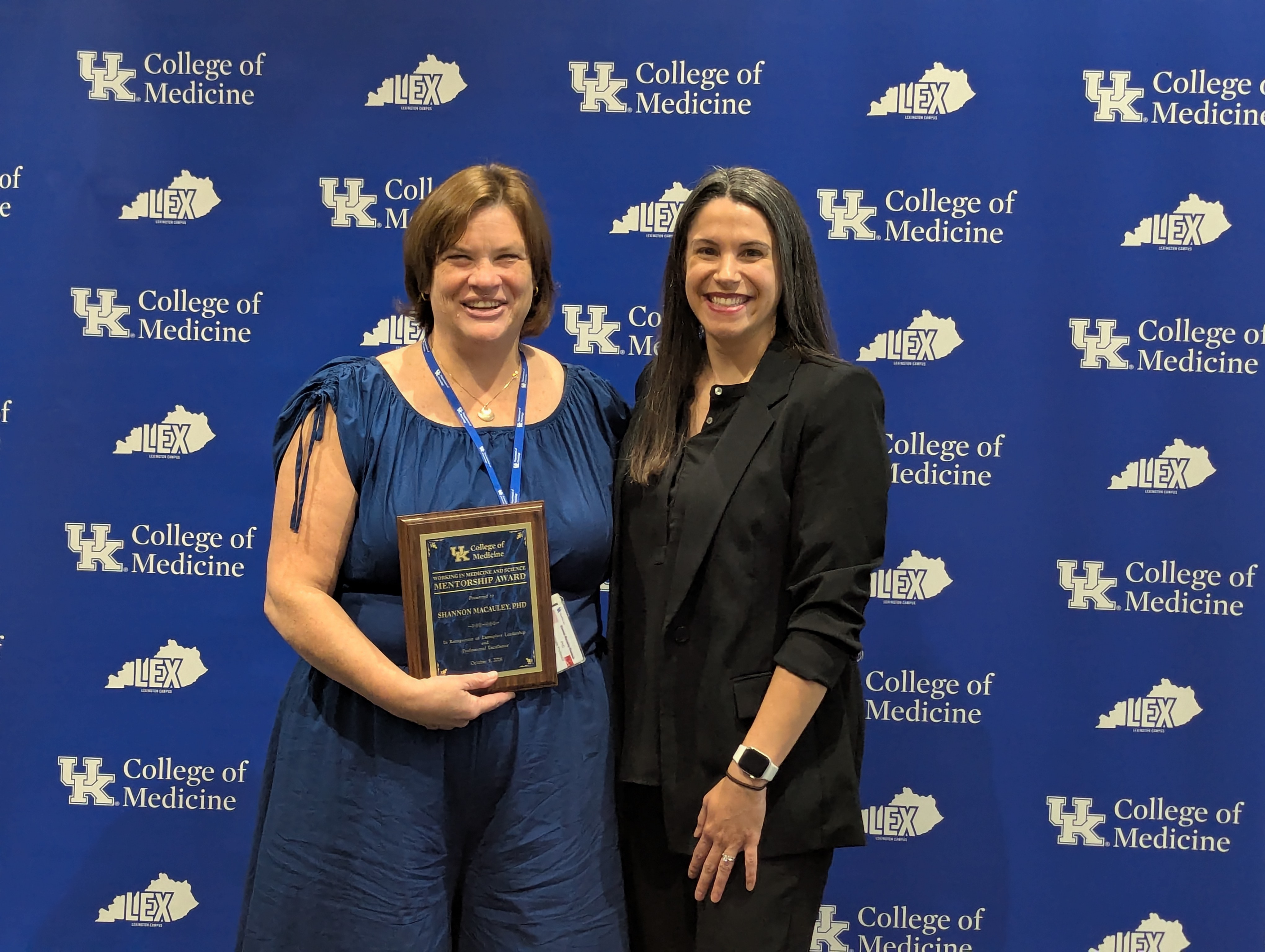 WIMS award winner Shannon Macauley, PhD accepts her award.
