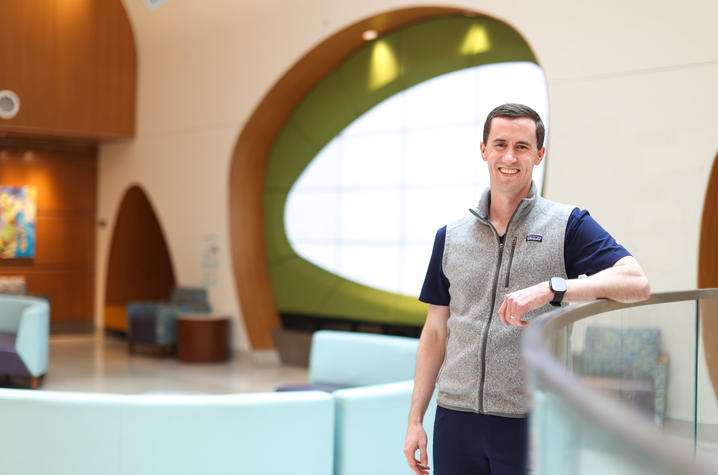 Vince stands inside KCH and poses for photo