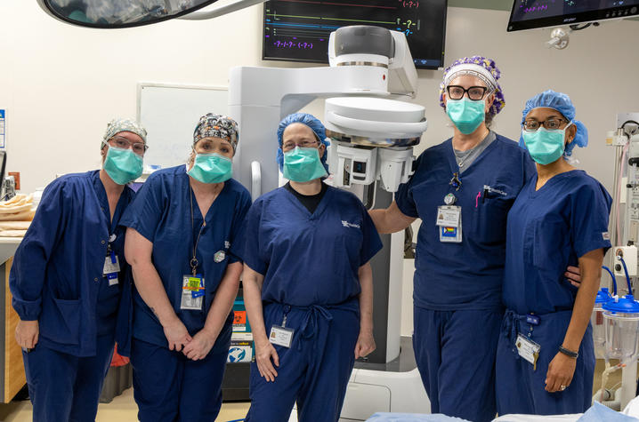 Since the FDA approved the Da Vinci SP for thoracic surgeries, Meyerson, Shah and their surgical teams (seen here posing in front of the Da Vinci) have performed 20 minimally invasive procedure
