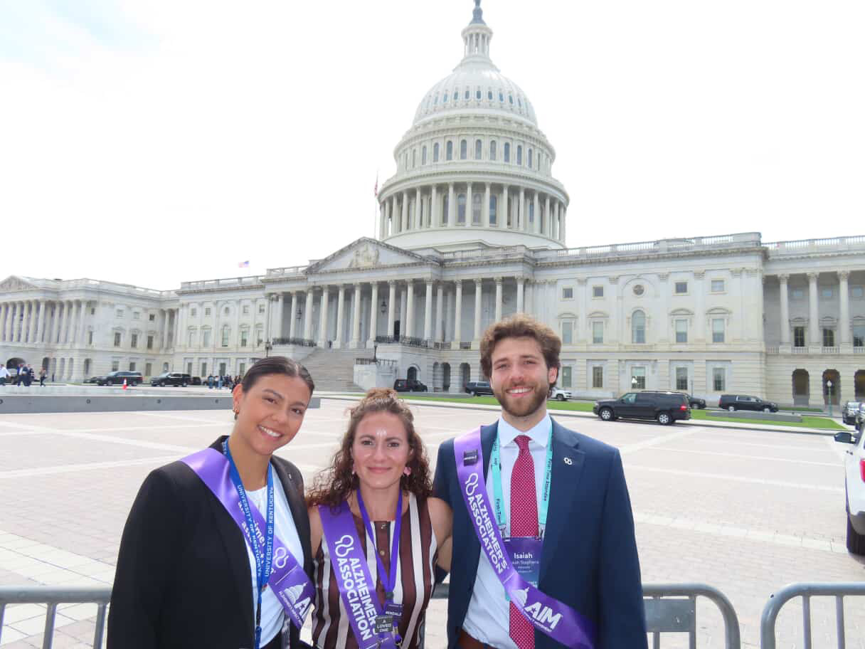 Manauis, Cox, and Stephens pose together outside Capitol Building