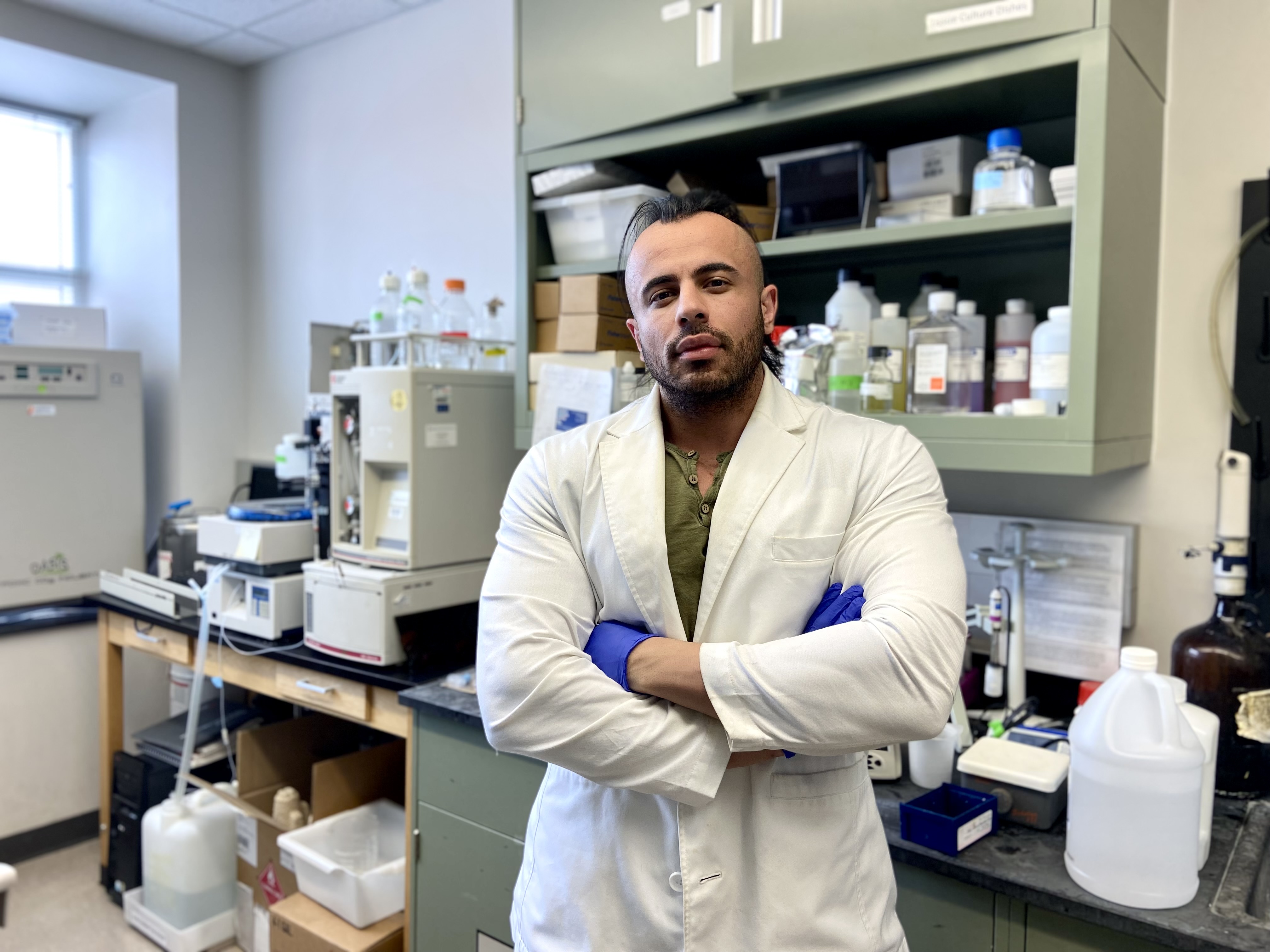 Aaron Chacon poses in the lab