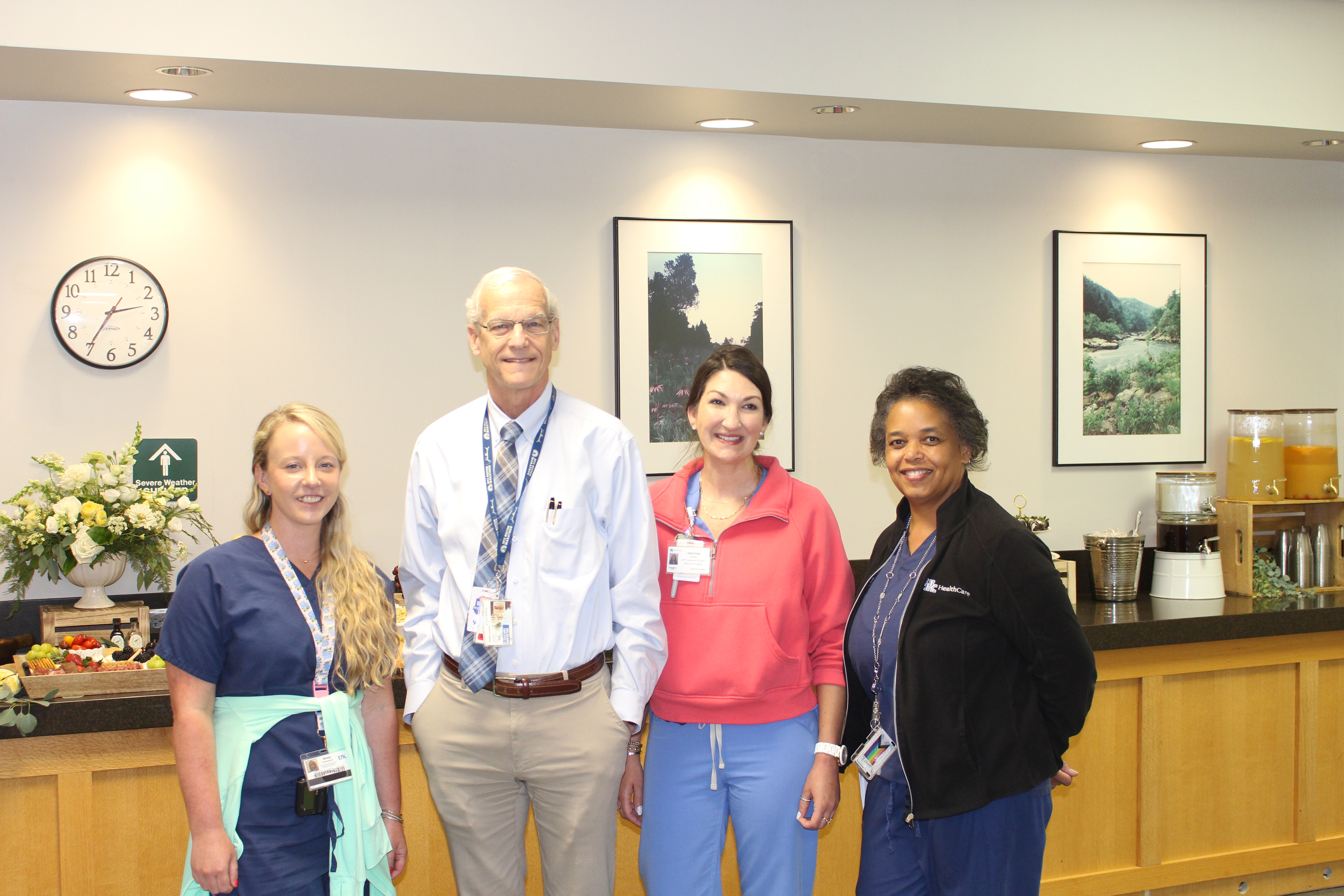 Dr. Eric Endean is standing among a group of Vascular Surgery support staff from Gill Heart and Vascular Institute.