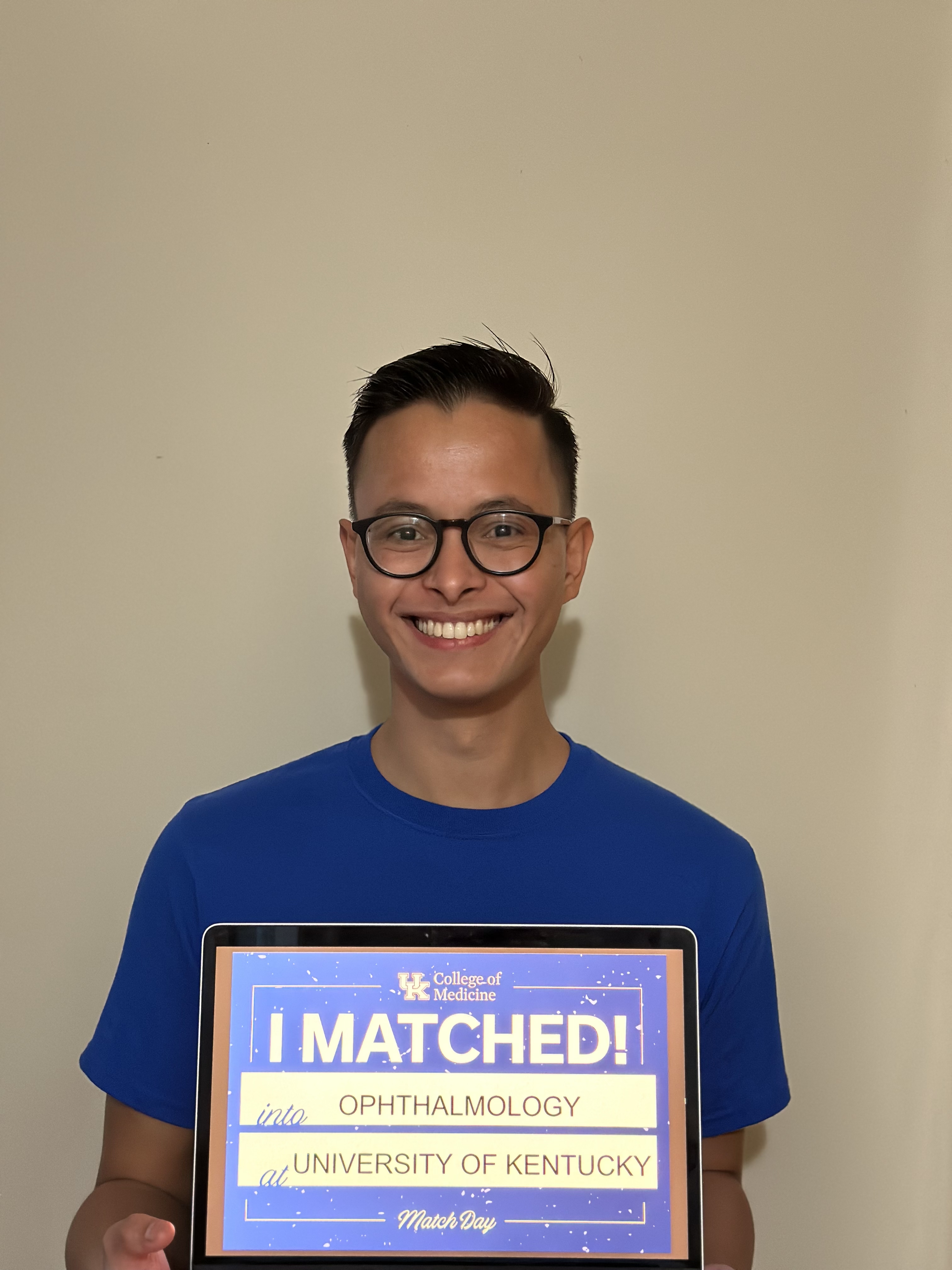 Med student holding "I matched" sign 