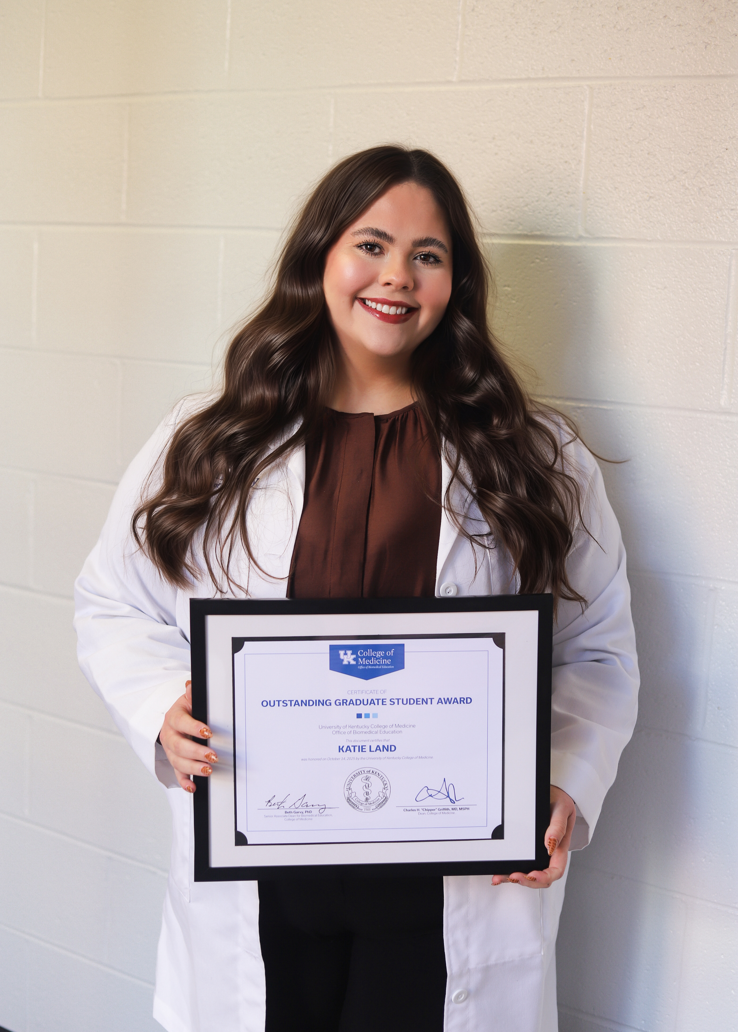 Land earned the 2025 "Outstanding Graduate Student Award" during the college's annual award convocation.