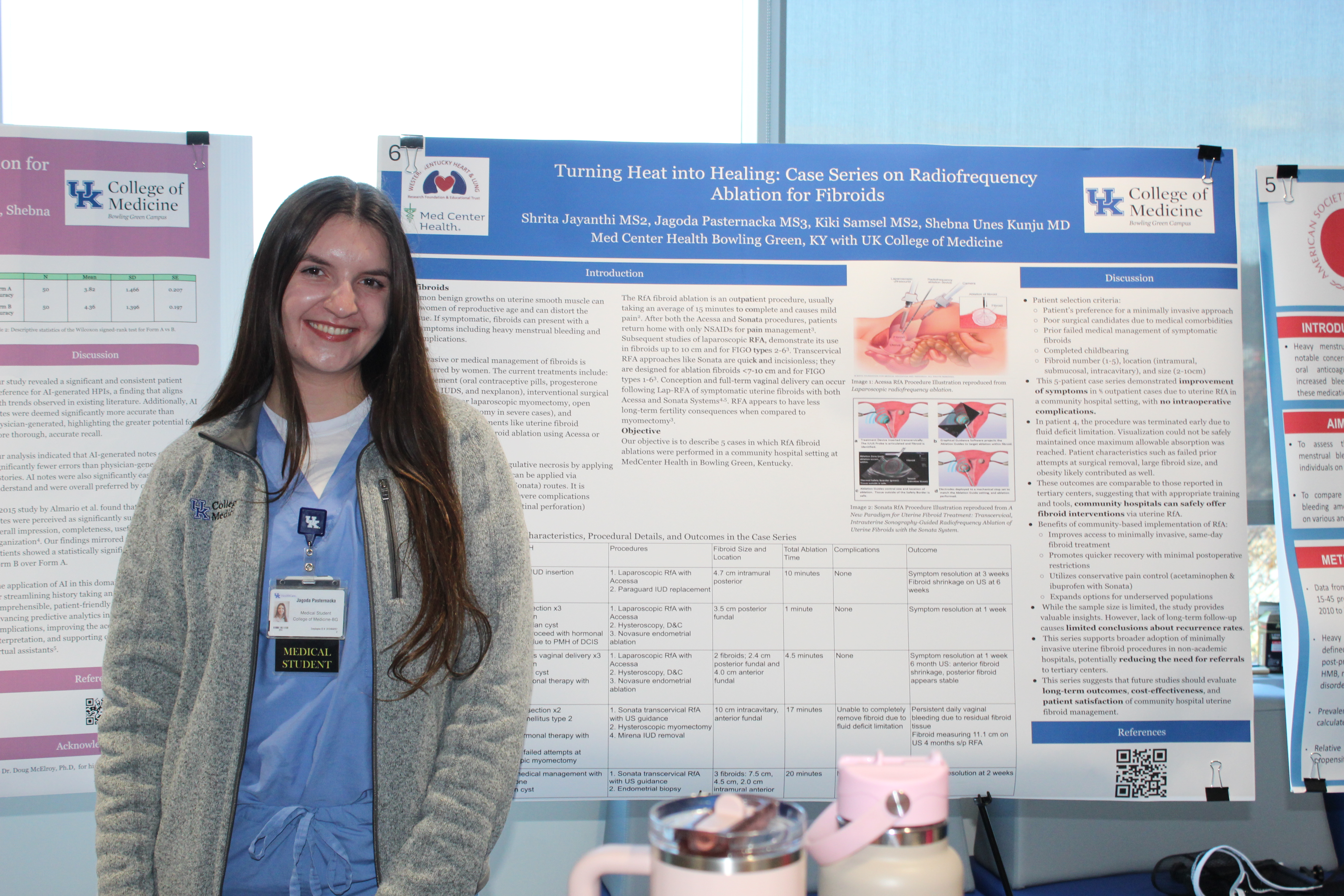 Bowling Green Campus student poses with her research poster