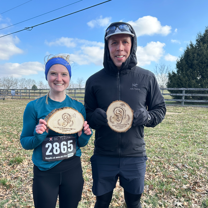 2025 Race Winners pose with their prizes - wood-burned ears made by Smith.