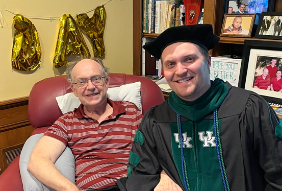 Andrew's father was unable to attend graduation in person, but the Arnold family held a private ceremony in their living room where Andrew was hooded by his dad.