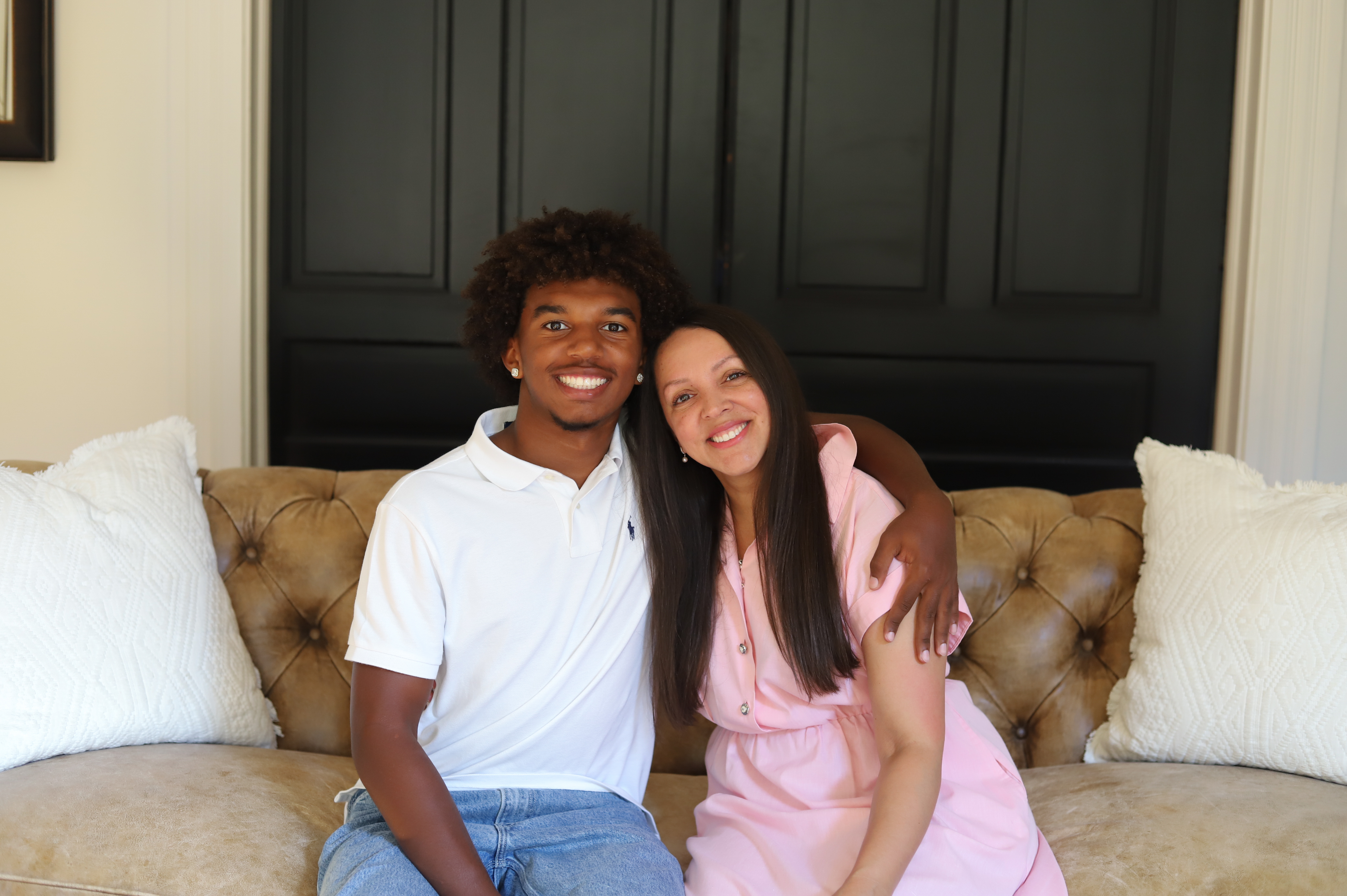 Raj and Dr. Jackson pose for a photo in their home. (Photo by Lily Wilder)