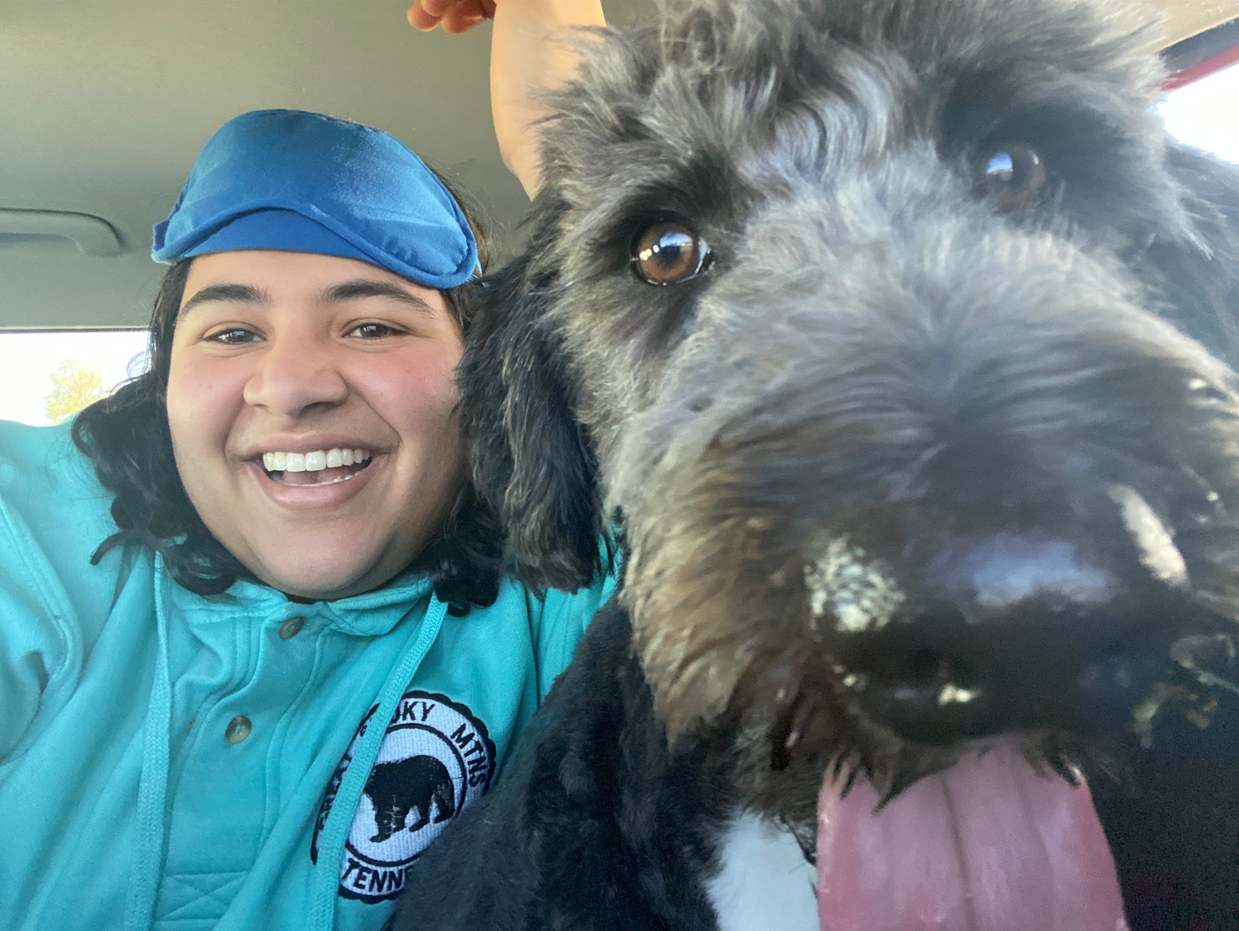 Challa and her dog, Patrick. "I couldn't have asked for a better partner in crime! Thanks to Patrick for always putting up with me"