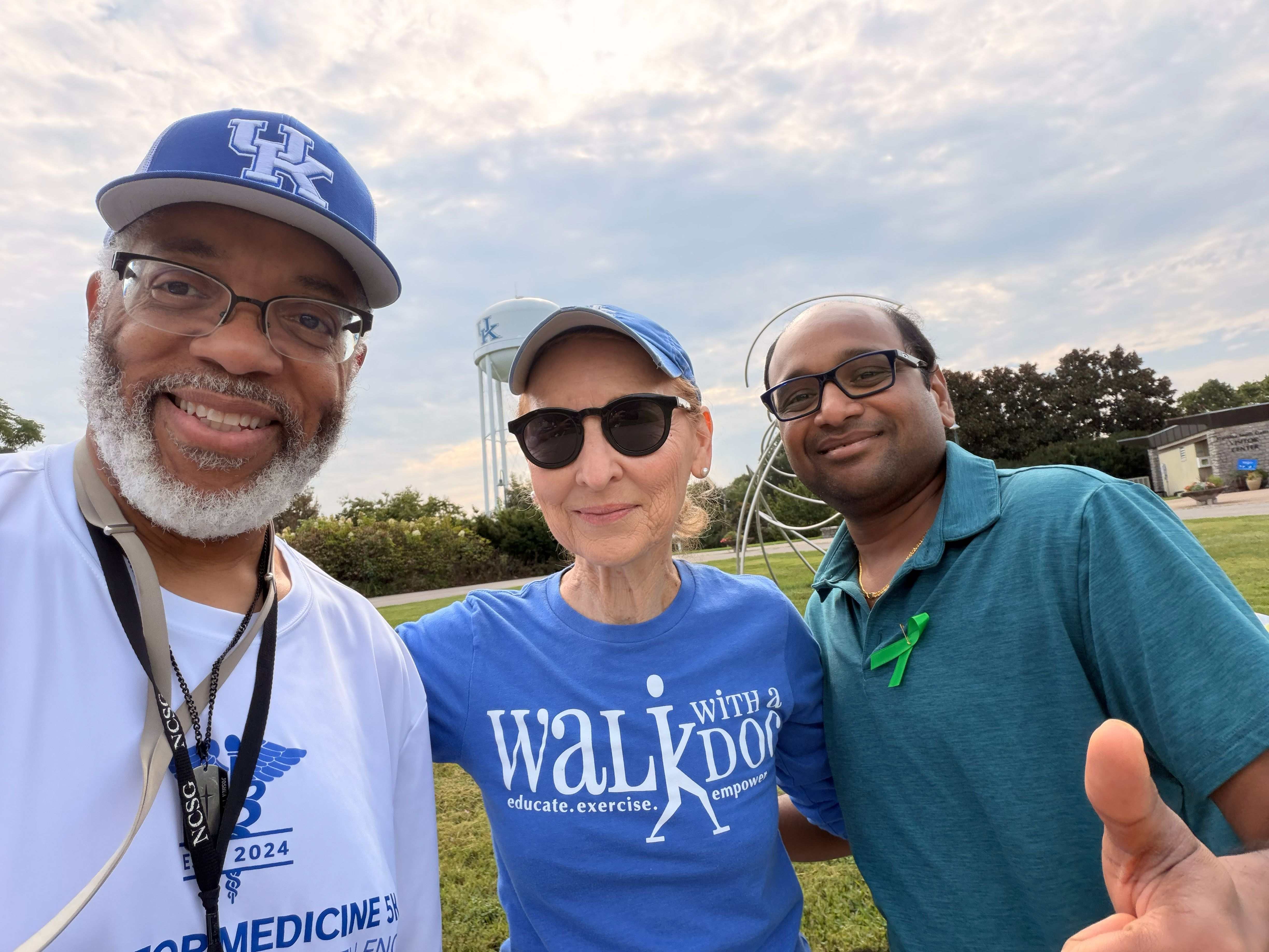 picture of two men and a women taking a selfie at the Arboretum