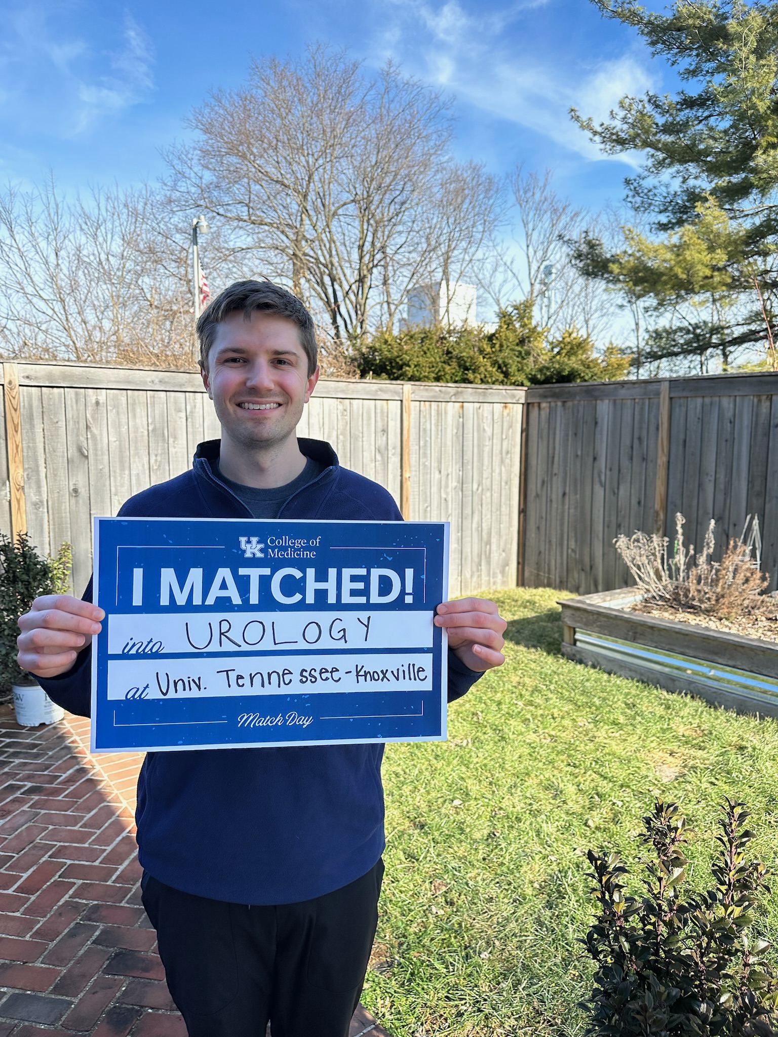 Med student holding "I matched" sign 